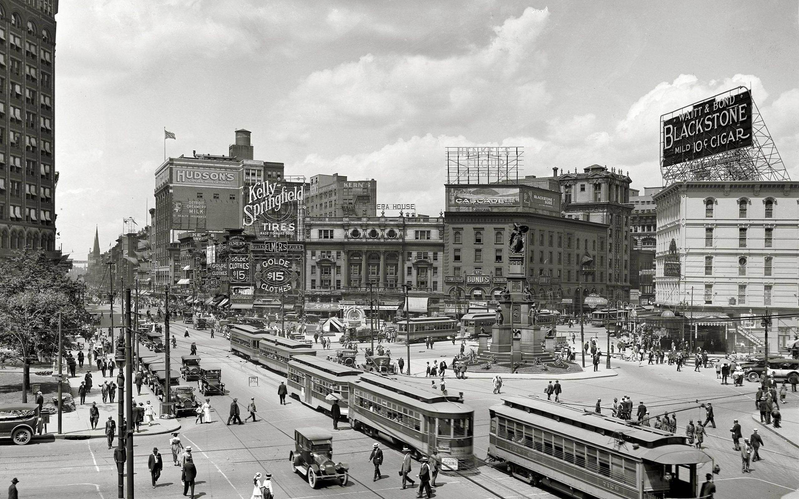 Vintage Detroit Street Scene with Trams and Advertisements HD Wallpaper