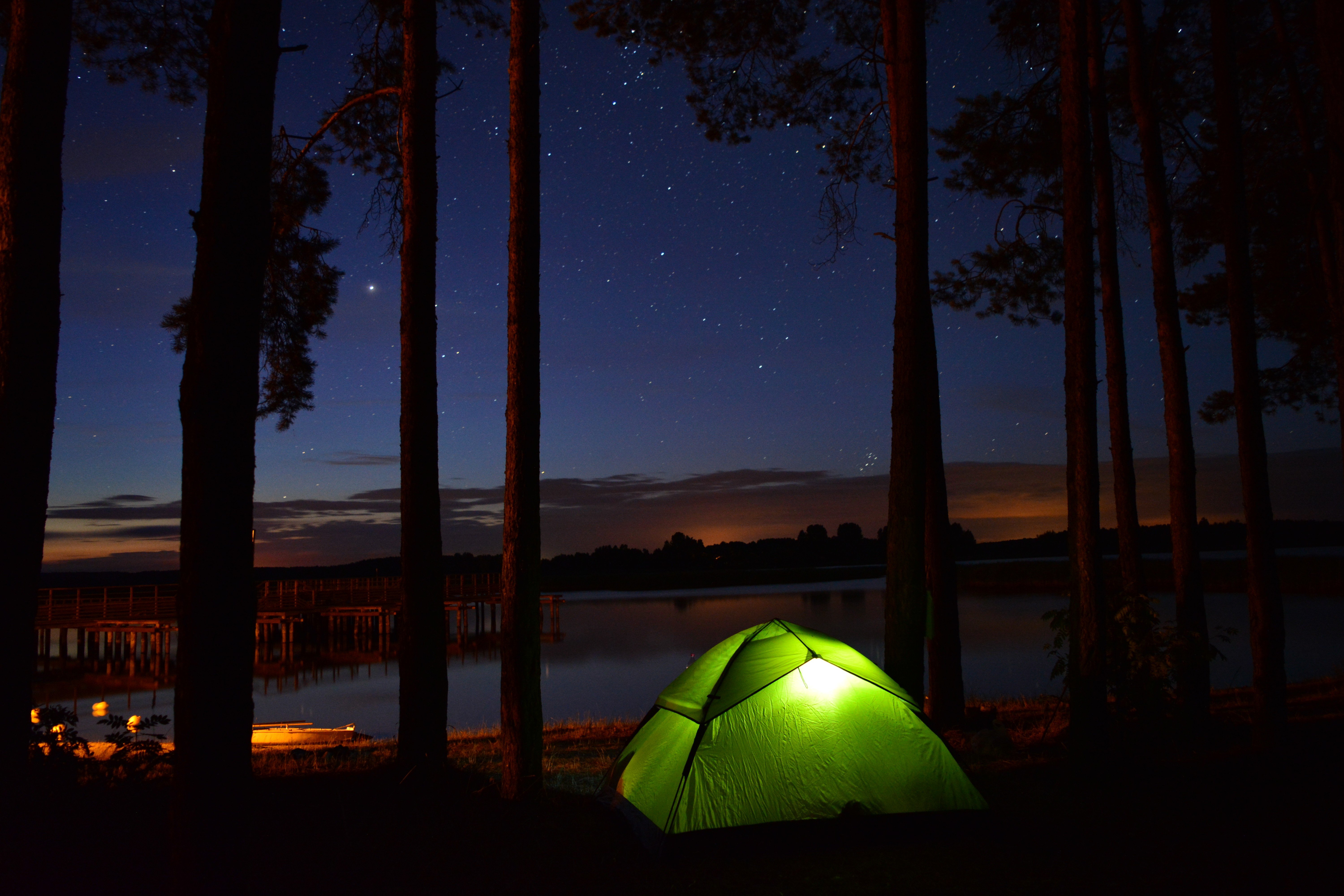 Night camping by the lake under the stars HD Wallpaper