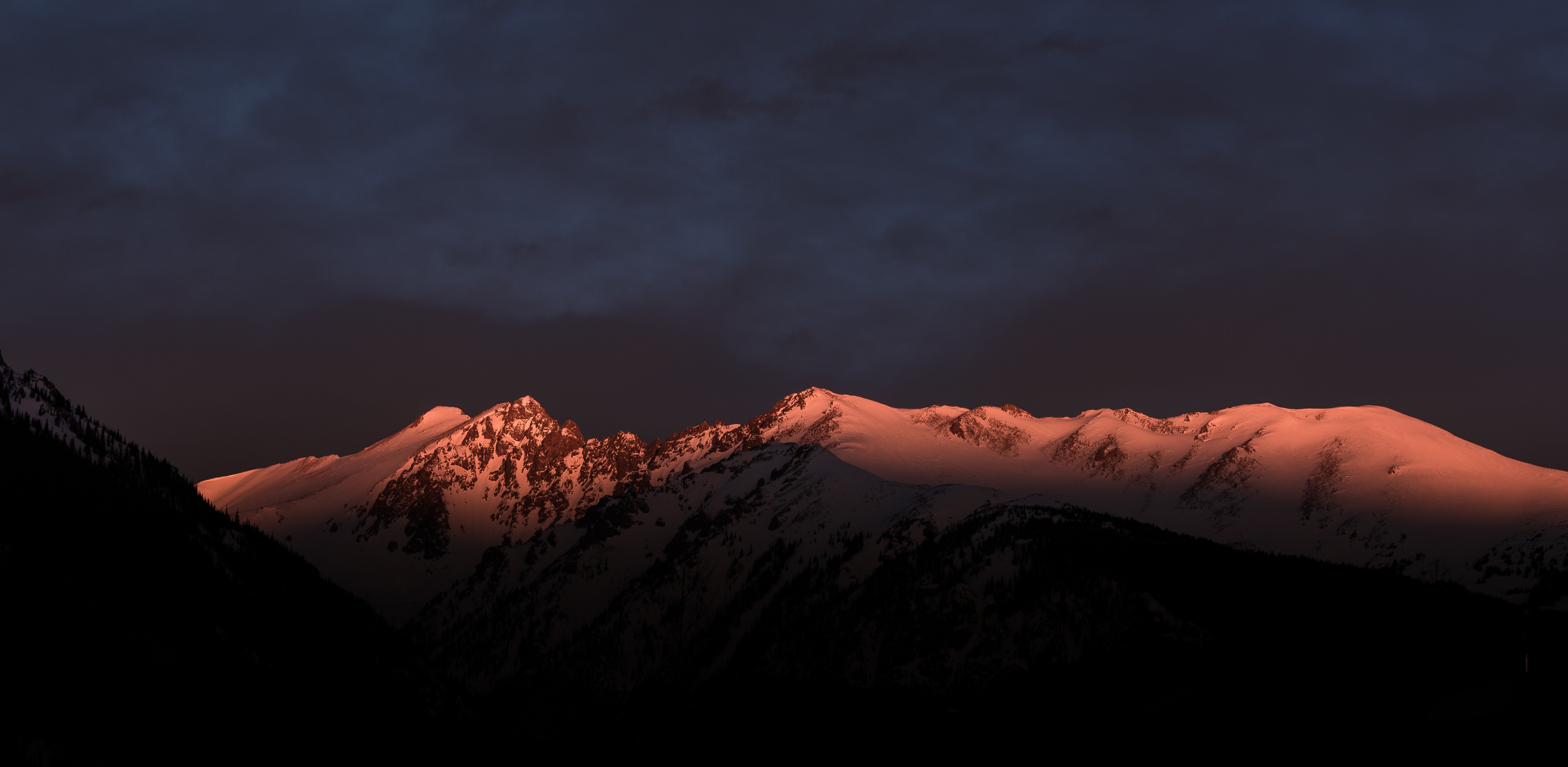 Snow-capped mountains at sunset HD Wallpaper