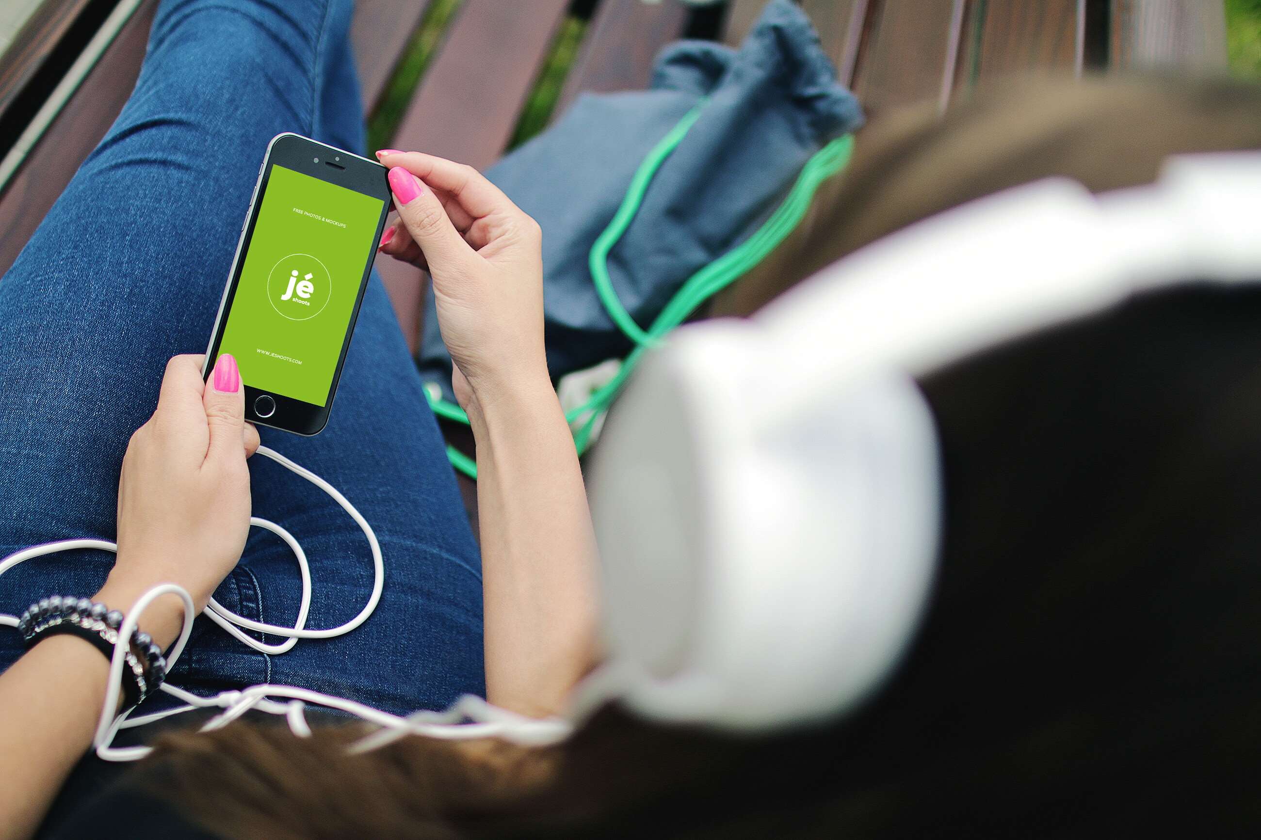 Woman holding iPhone 6 with headphones HD Wallpaper