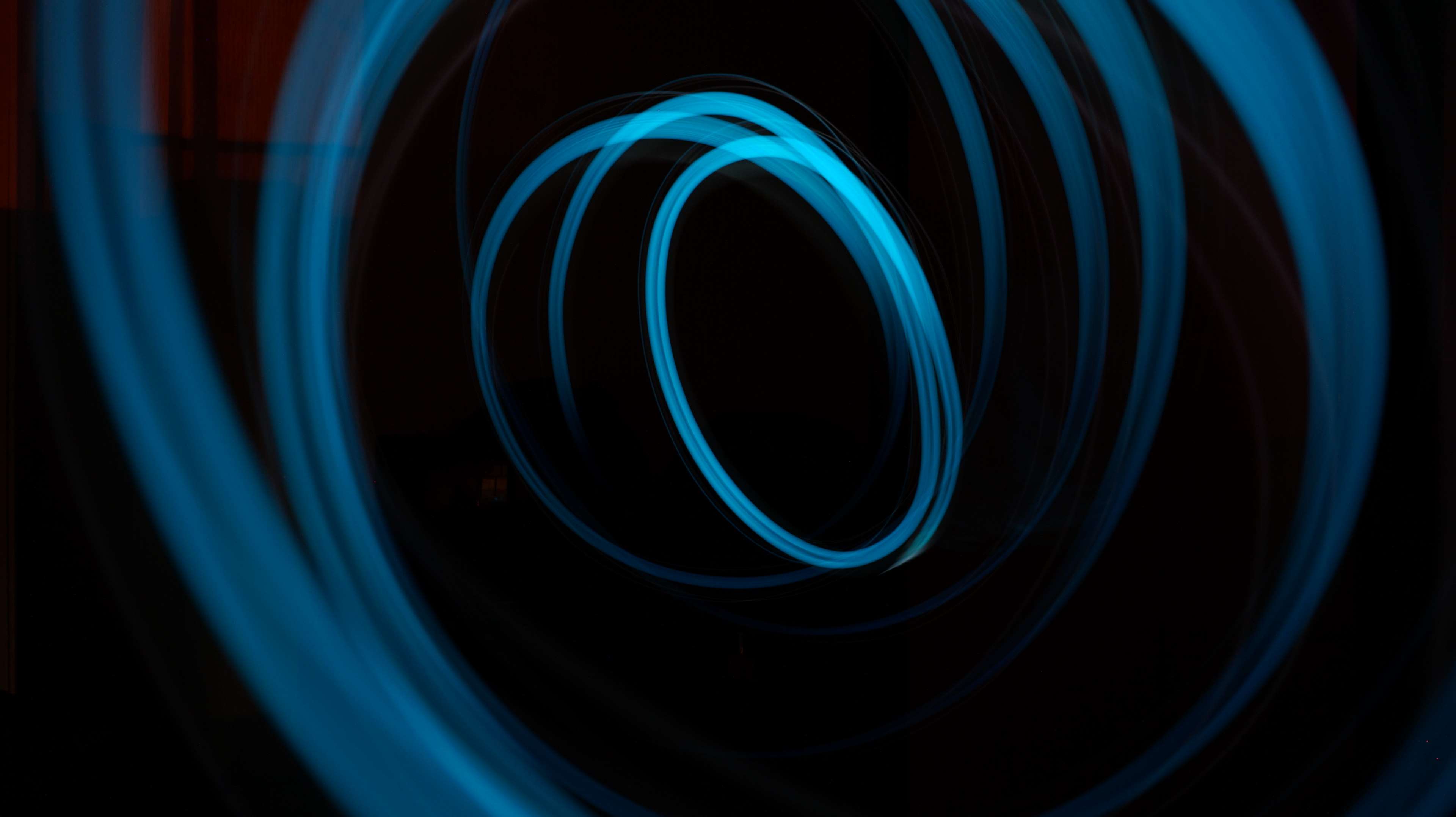 Abstract blue light trails in dark HD Wallpaper