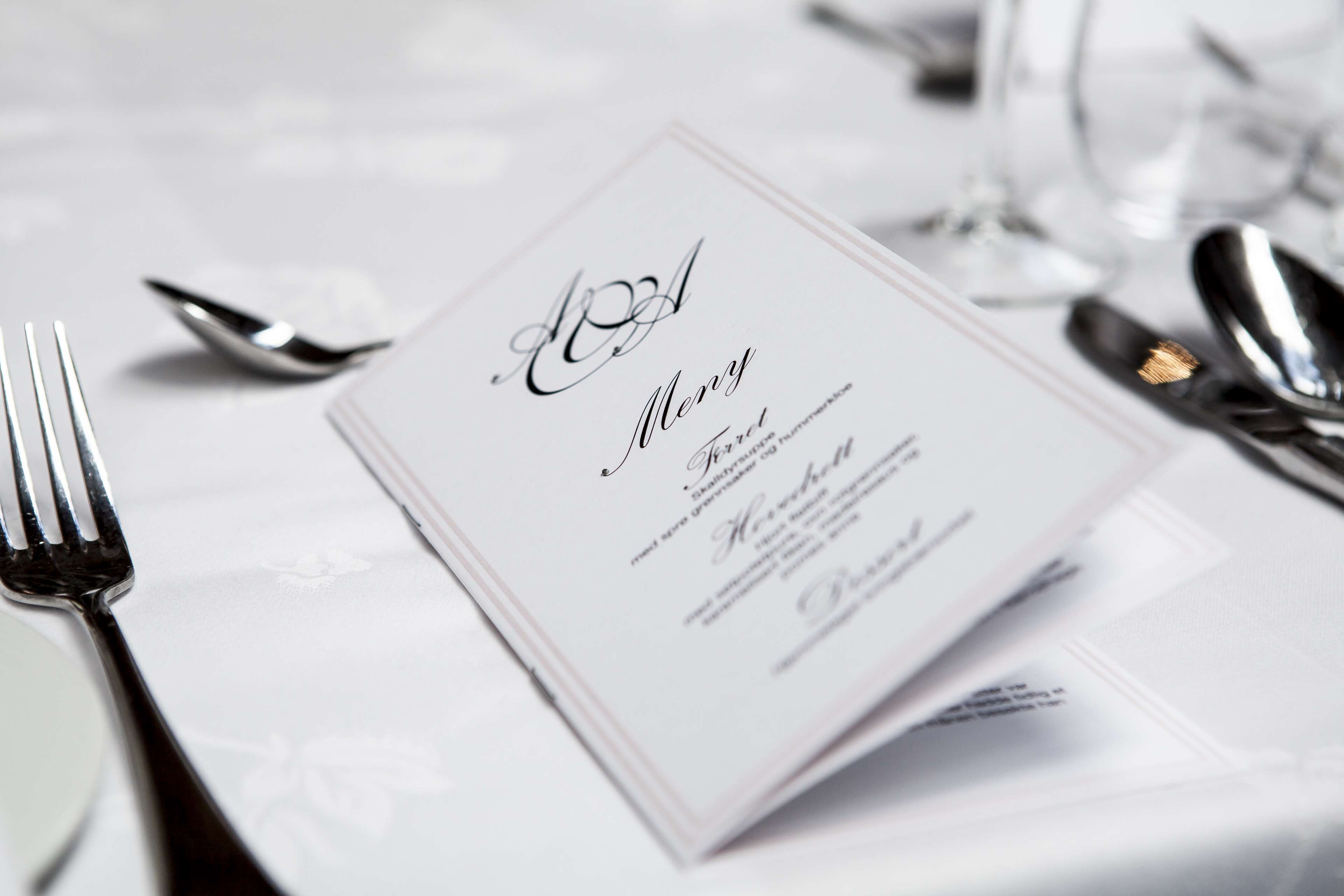 Elegant menu on a formal dining table setting HD Wallpaper