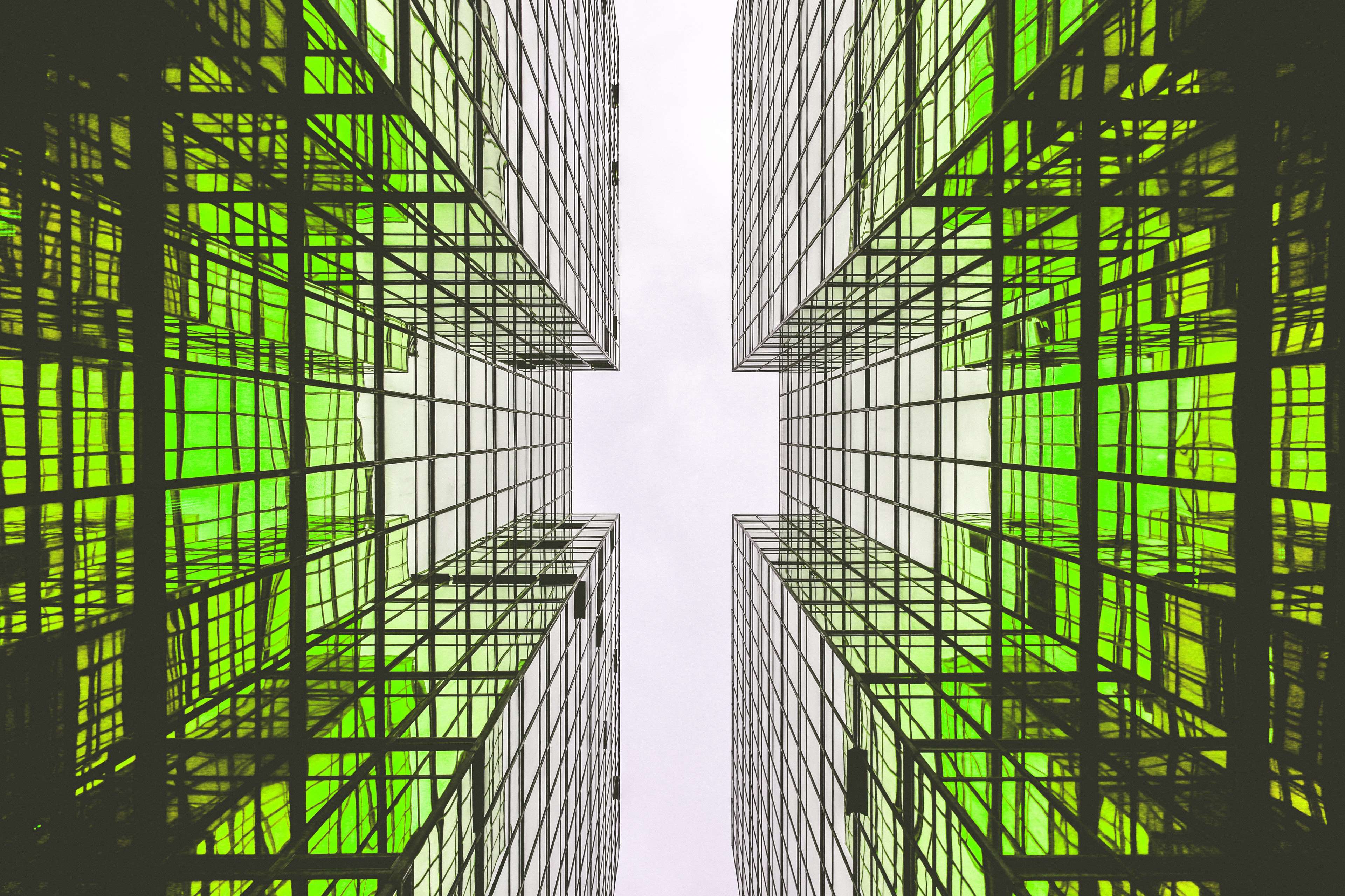 Modern glass buildings with green tint HD Wallpaper