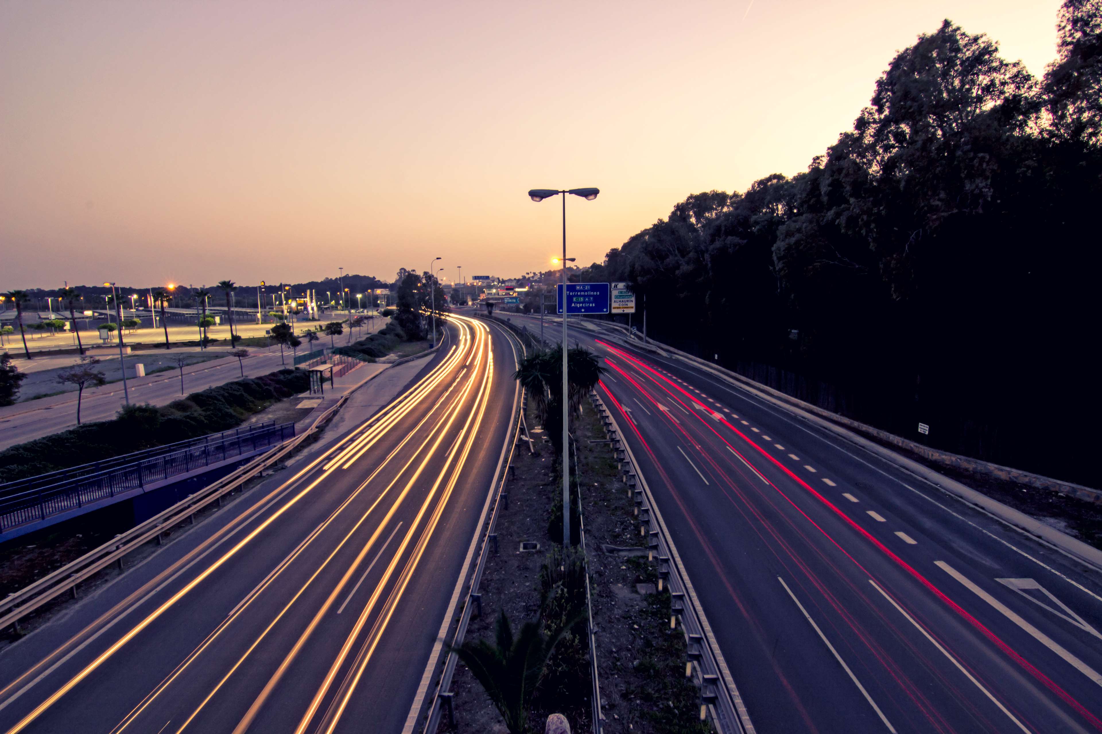 Highway light trails at sunset 4K HD Wallpaper