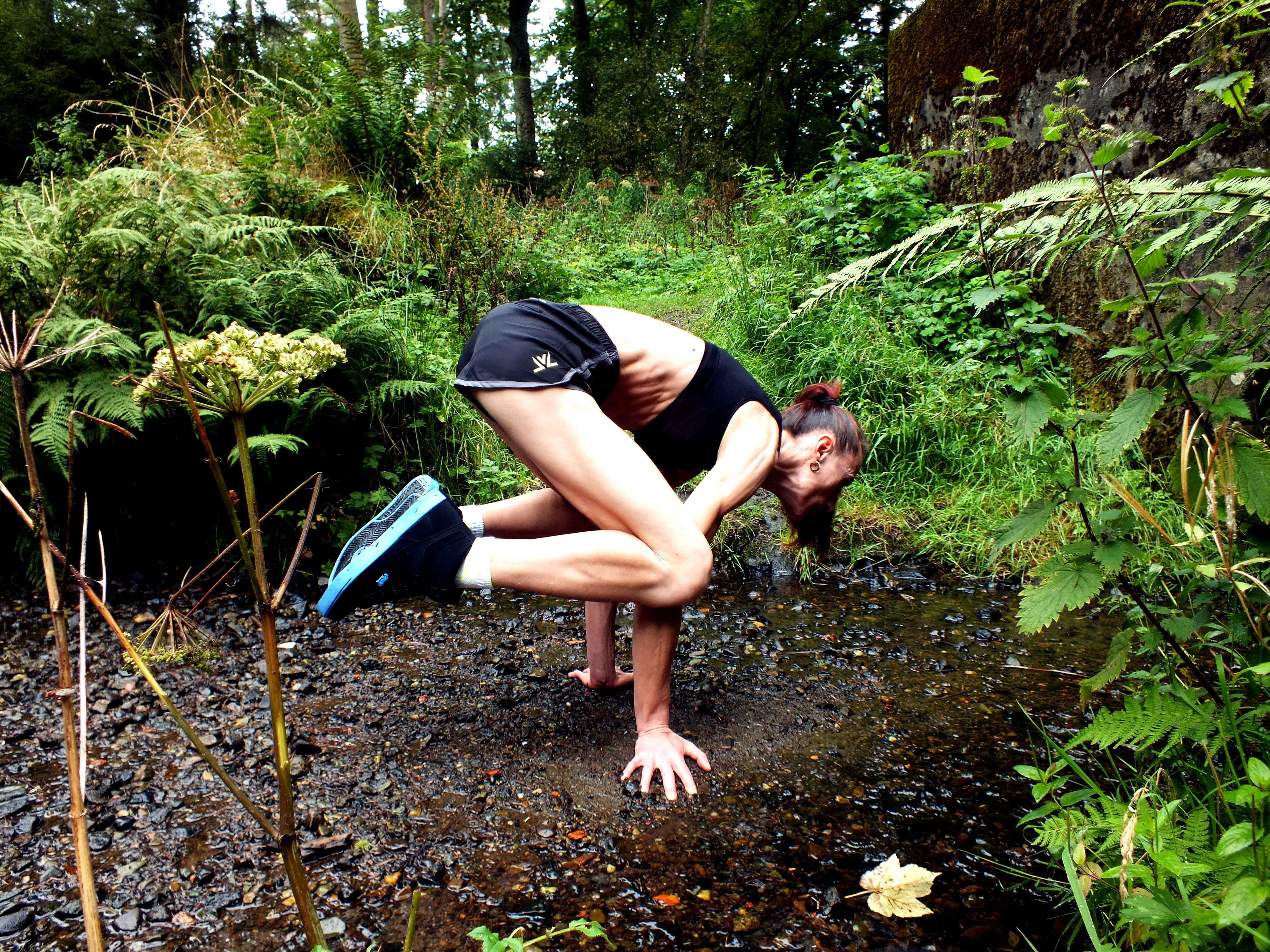 Woman performing yoga pose in nature HD Wallpaper