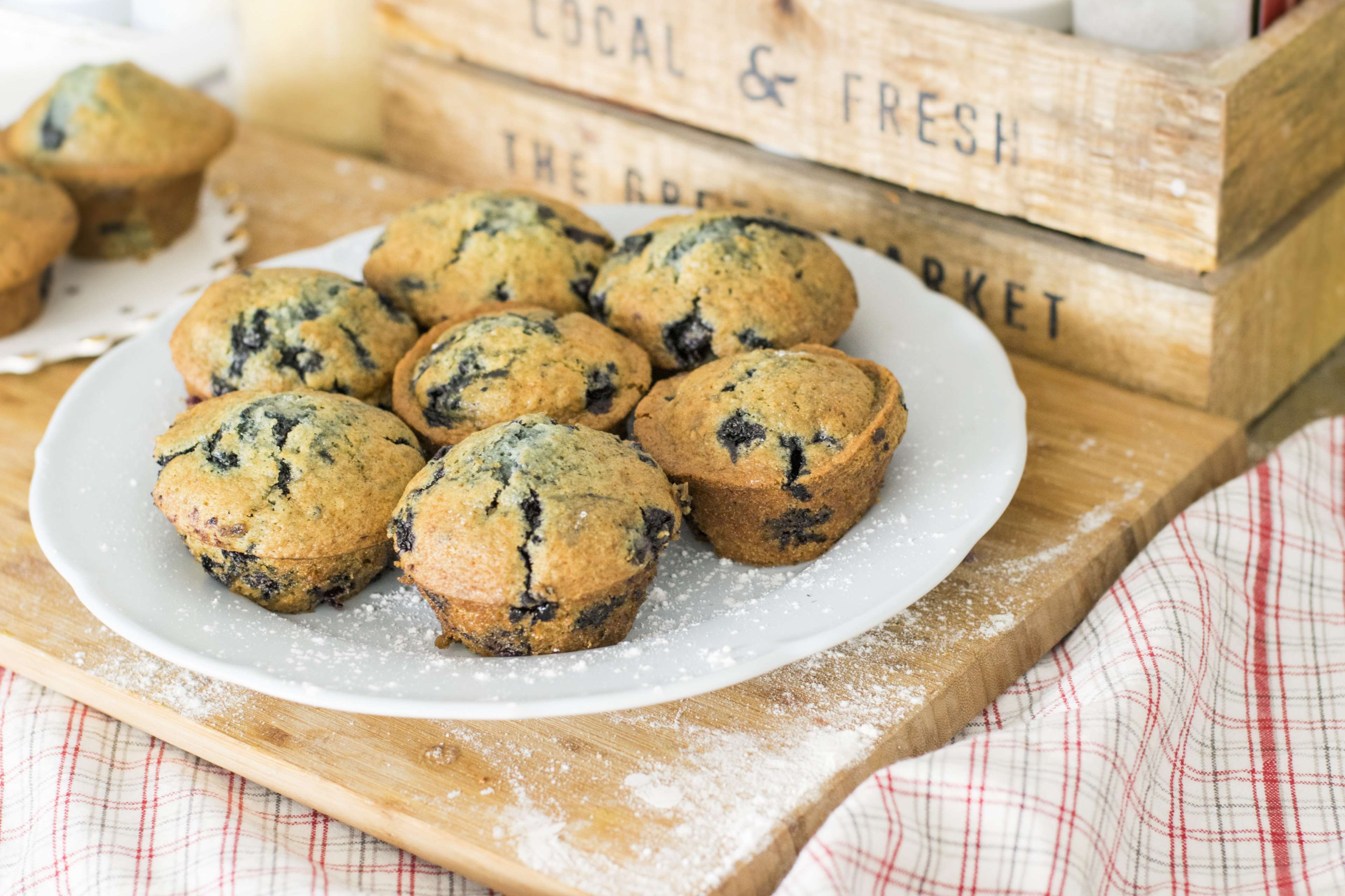 Blueberry muffins on a plate with wooden crates HD Wallpaper