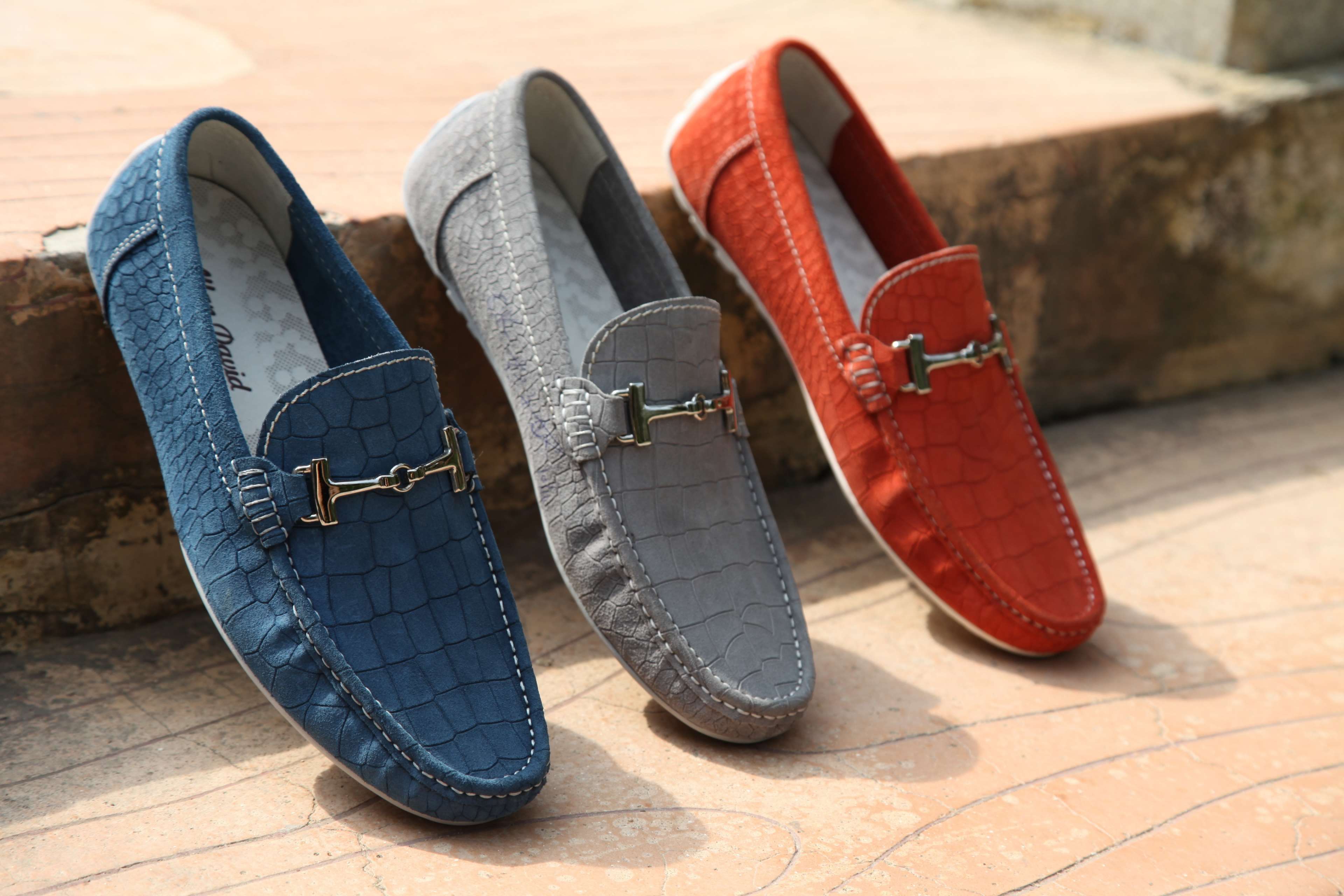 Three pairs of leather loafers with metal buckles HD Wallpaper