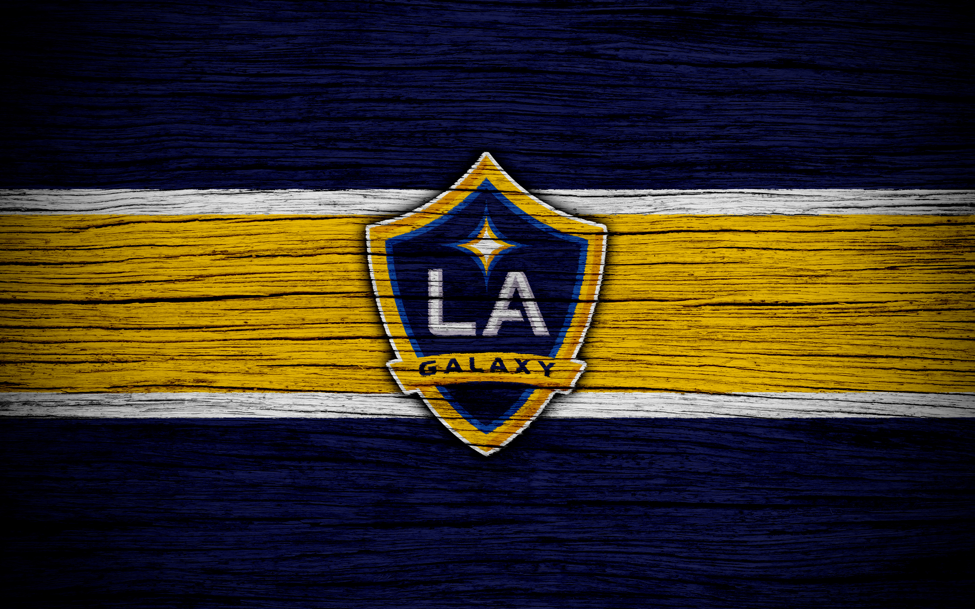 LA Galaxy logo on a wooden background HD Wallpaper