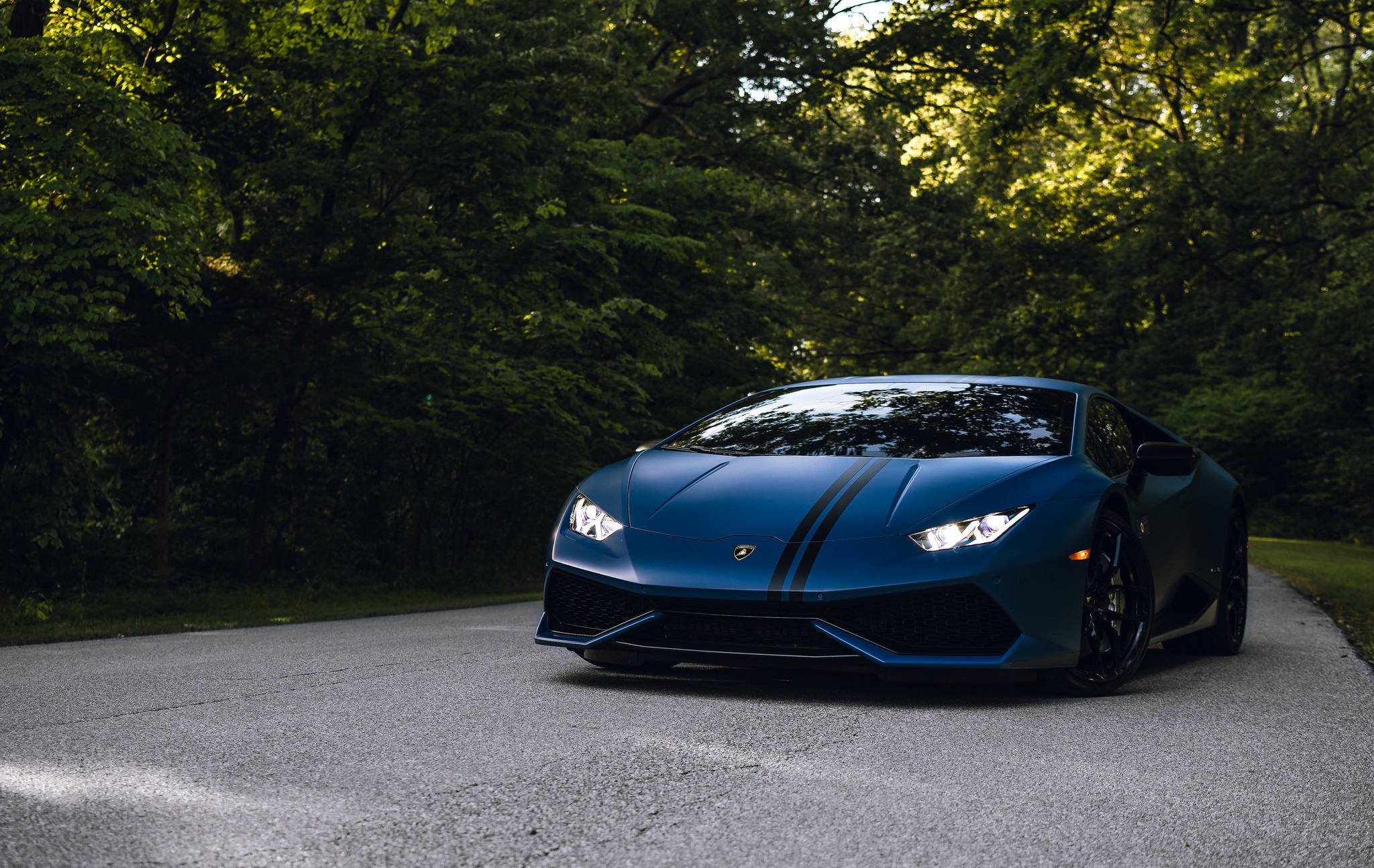 Blue Lamborghini Huracan with black stripes on a road HD Wallpaper