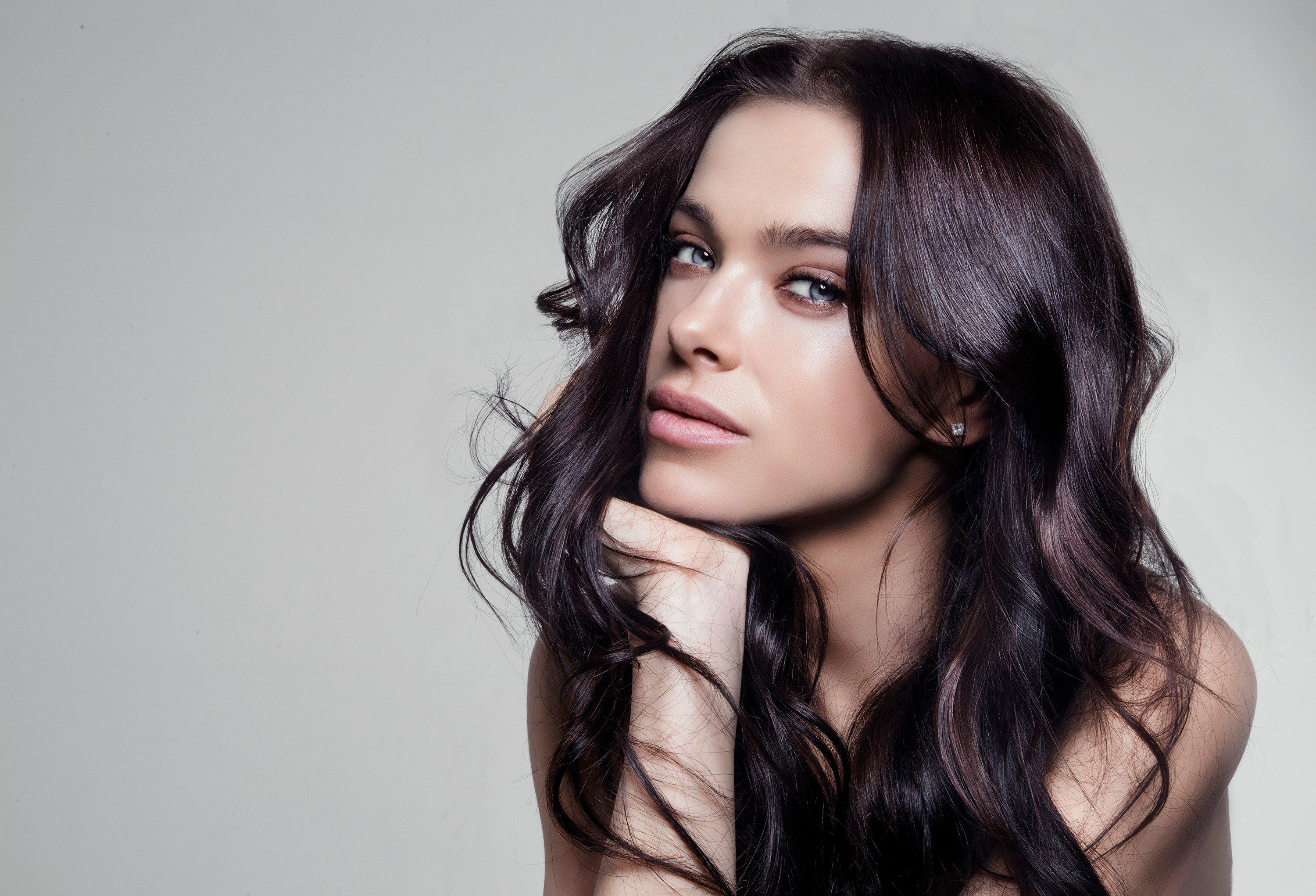 Woman with long dark hair and blue eyes HD Wallpaper