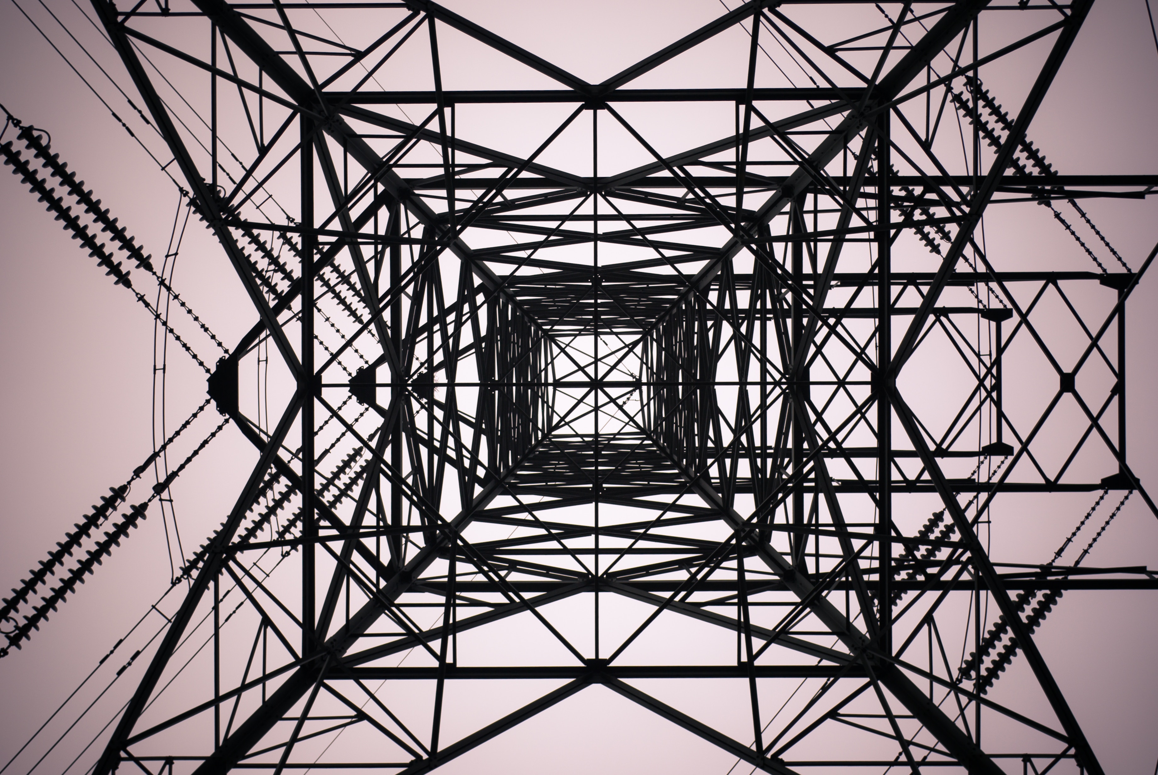Looking up at a steel electricity pylon structure HD Wallpaper