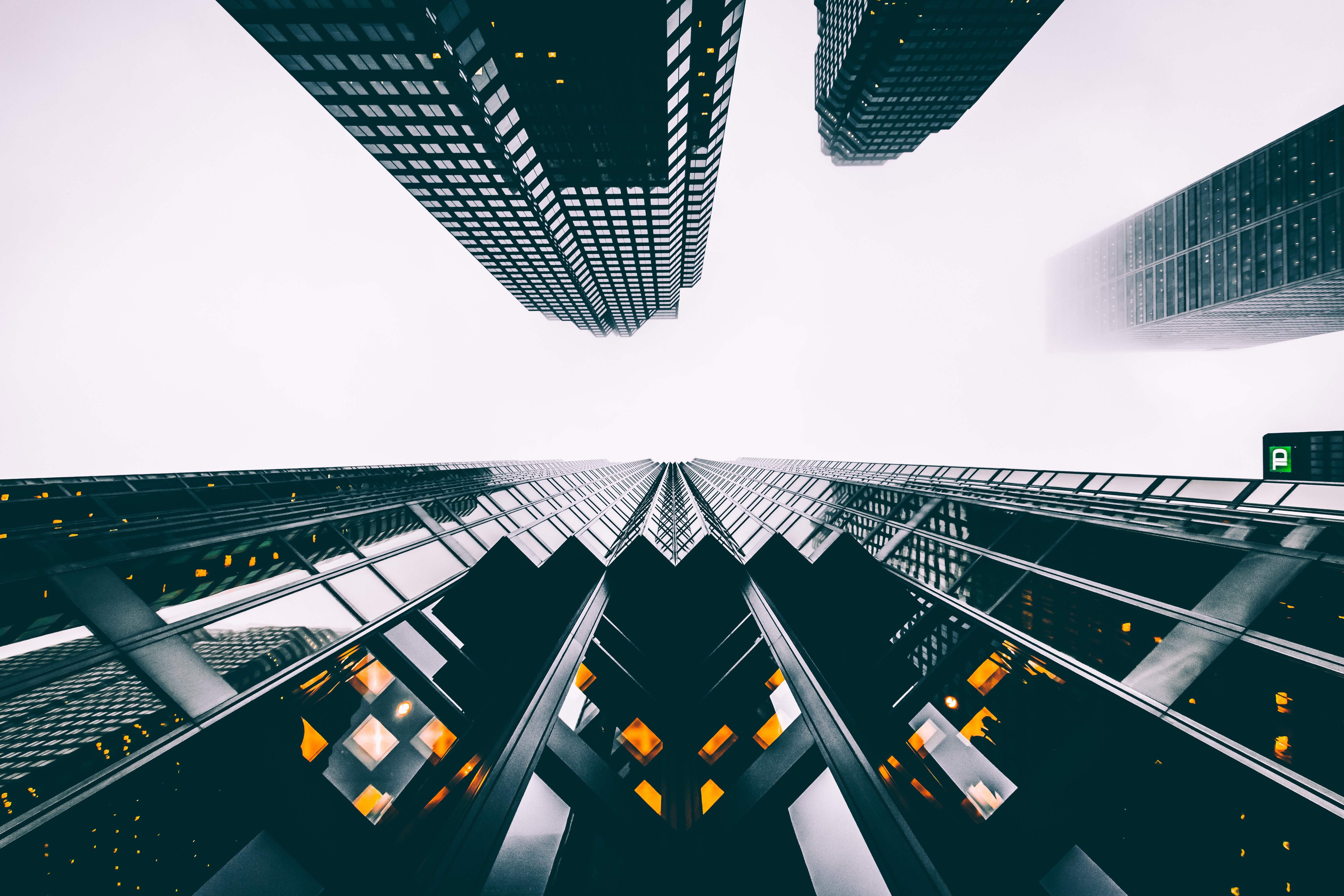 Looking up at skyscrapers in Toronto on a foggy day HD Wallpaper