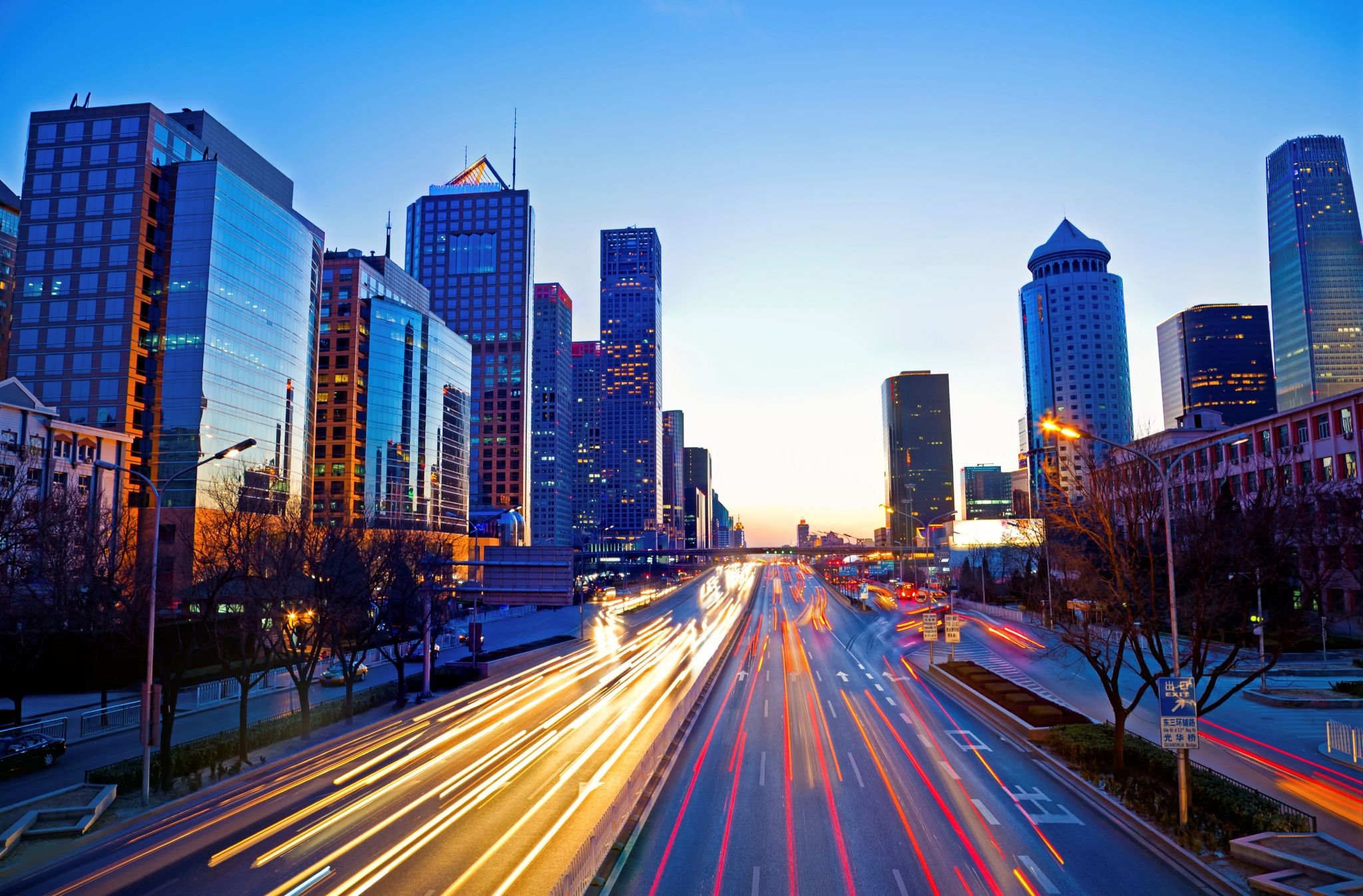Cityscape with light trails at dusk HD Wallpaper