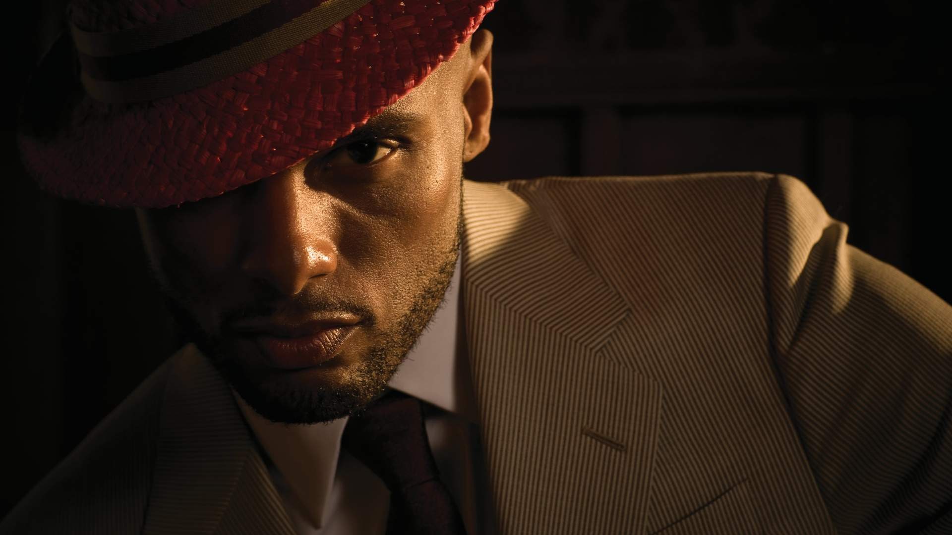 Kenny Lattimore wearing a red hat and suit HD Wallpaper