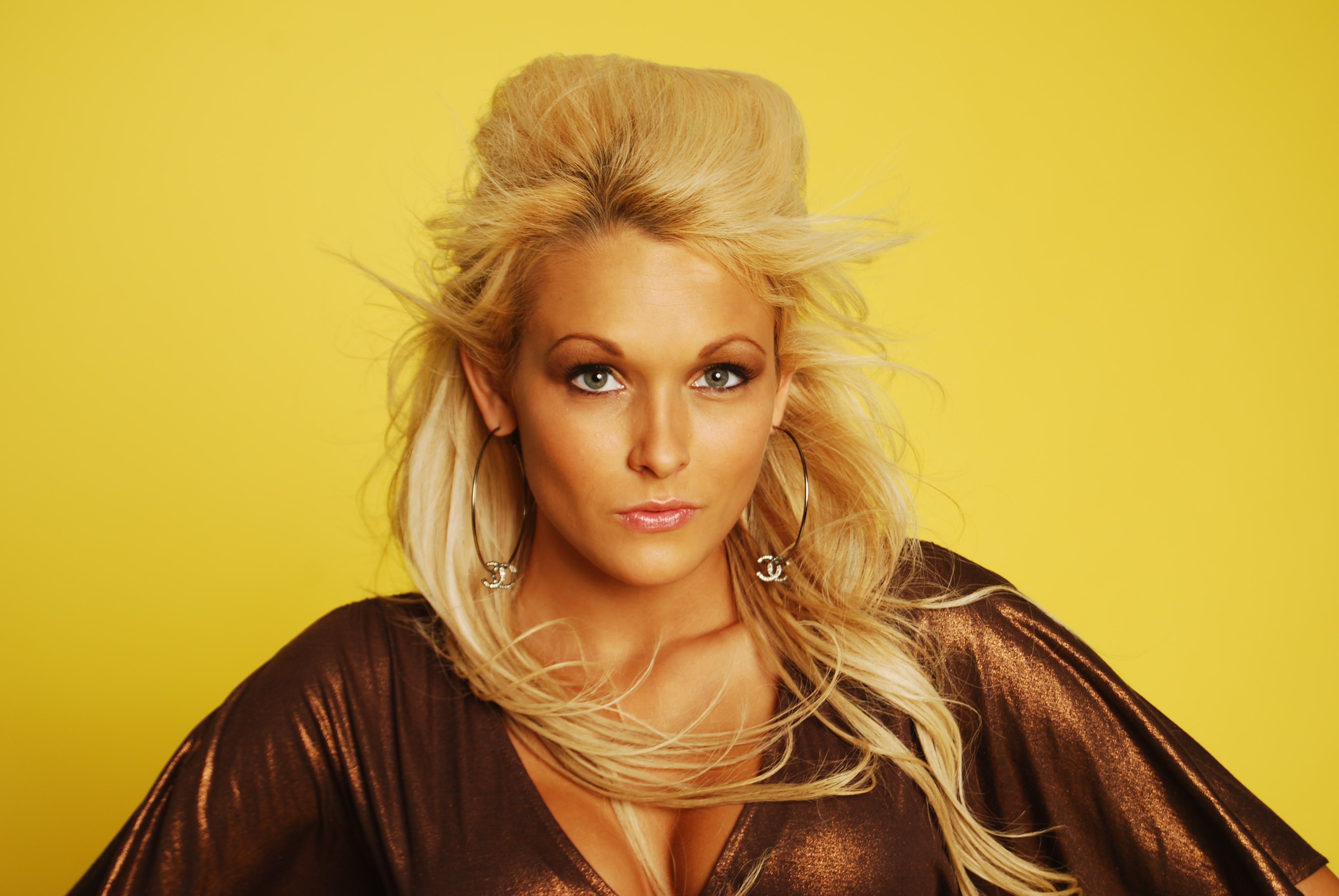 Blonde Woman with Flowing Hair and Metallic Dress HD Wallpaper