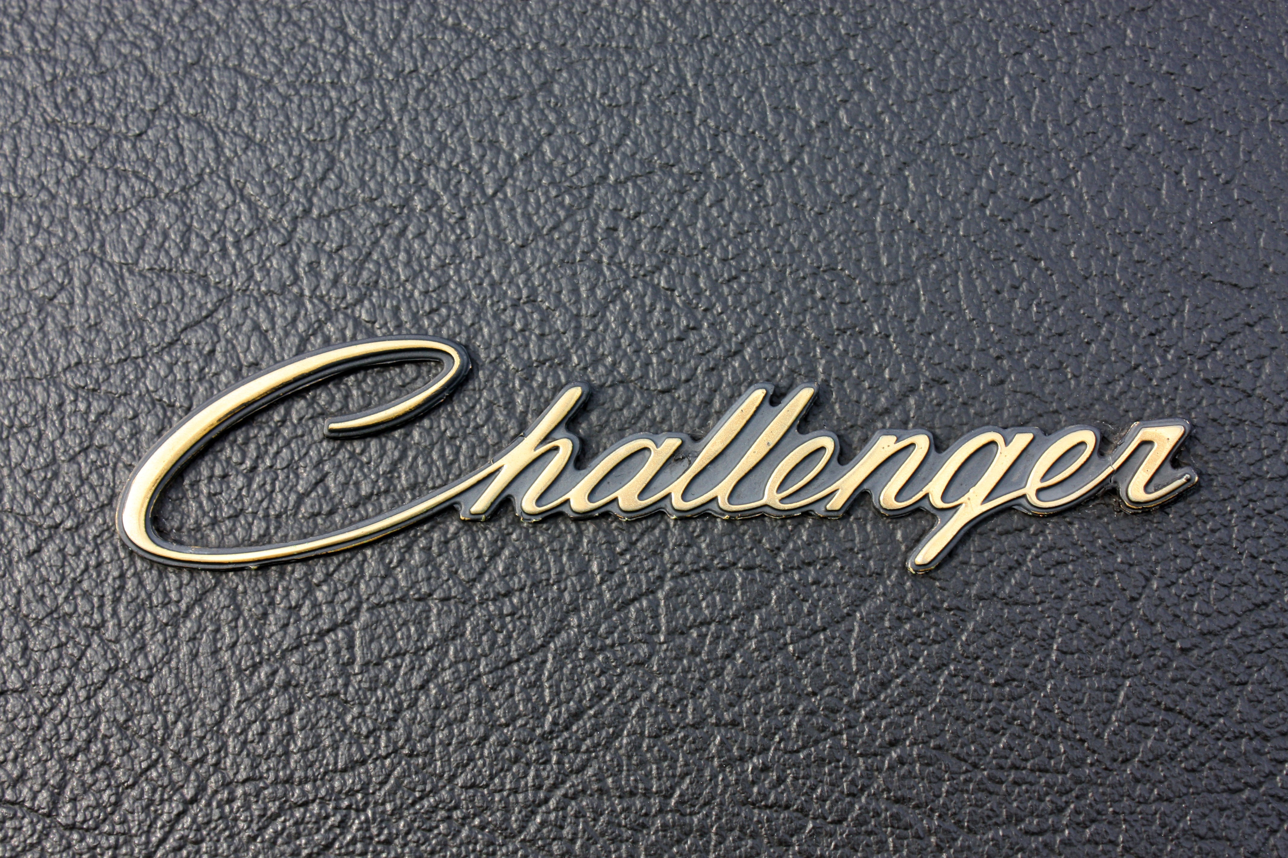 Challenger emblem on a textured surface HD Wallpaper