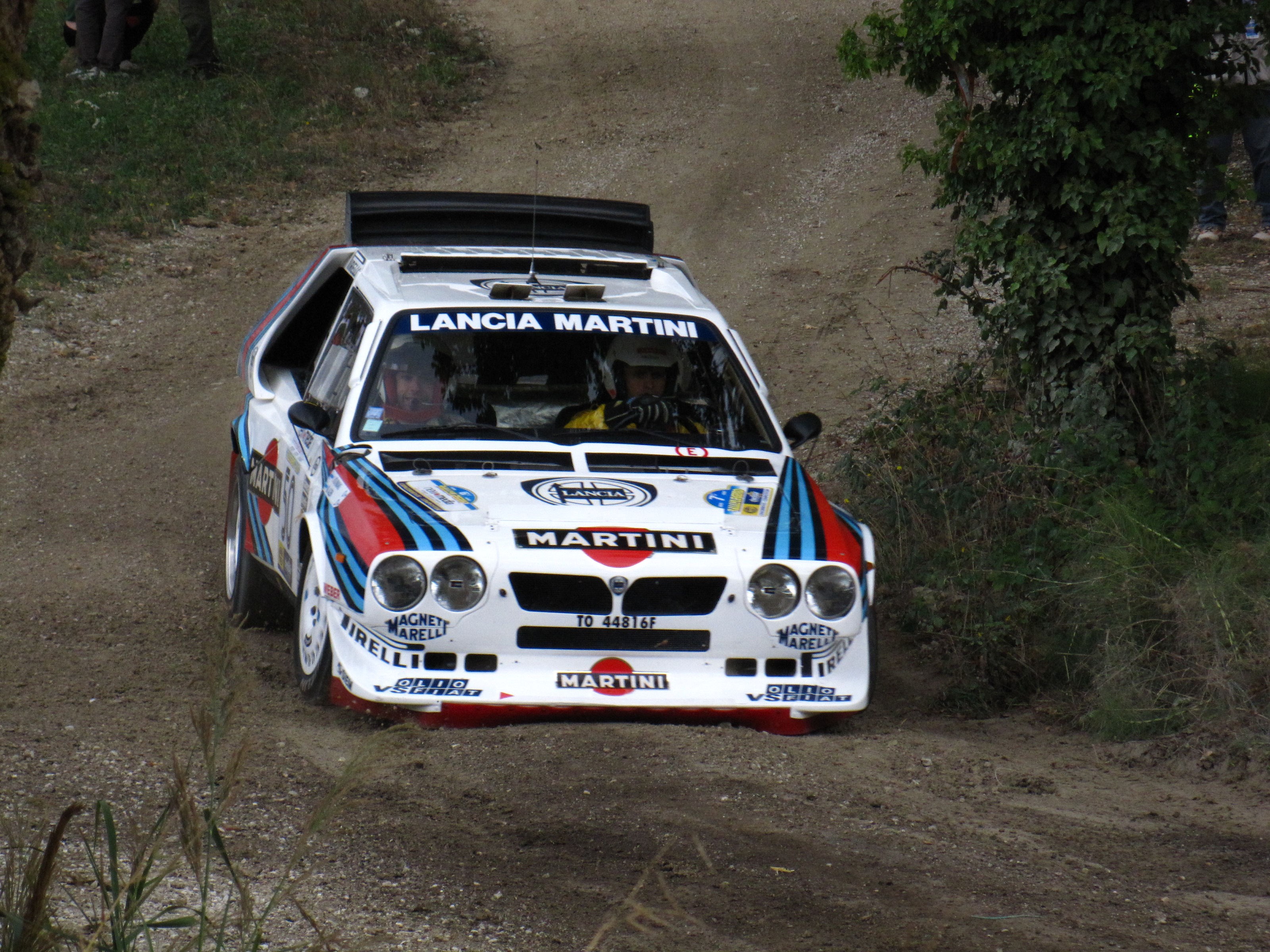 Lancia Martini rally car on a dirt track HD Wallpaper