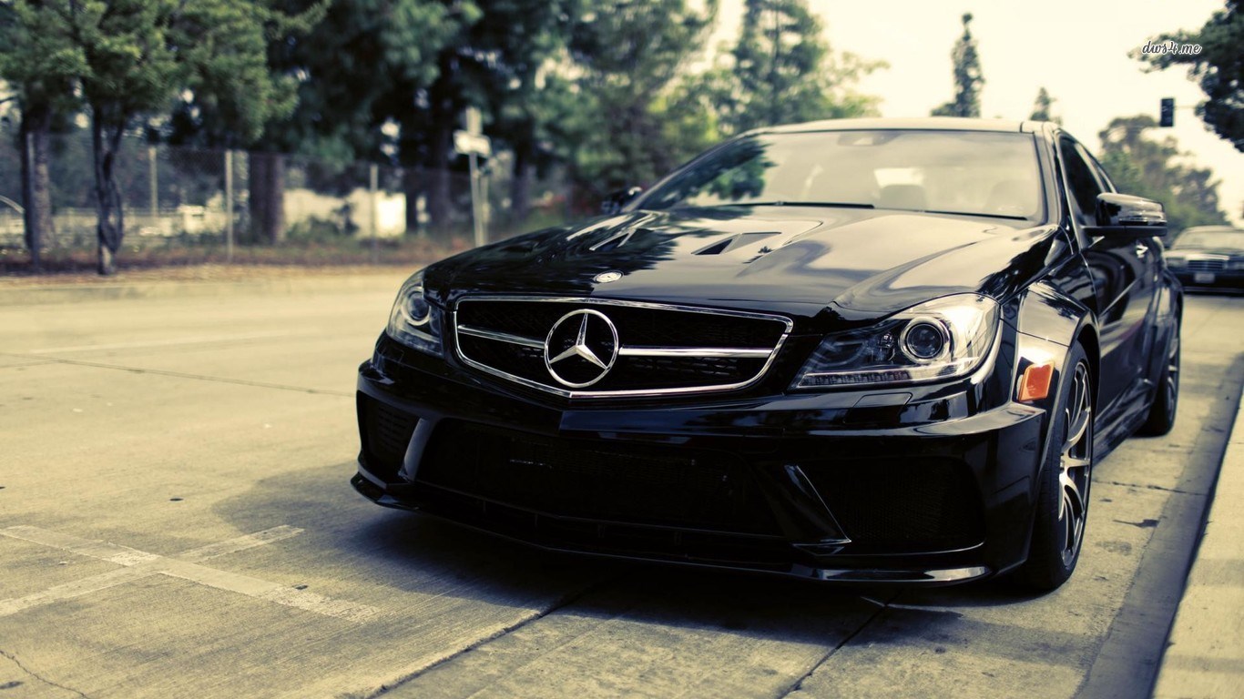 Black Mercedes-Benz C63 AMG parked on street HD Wallpaper