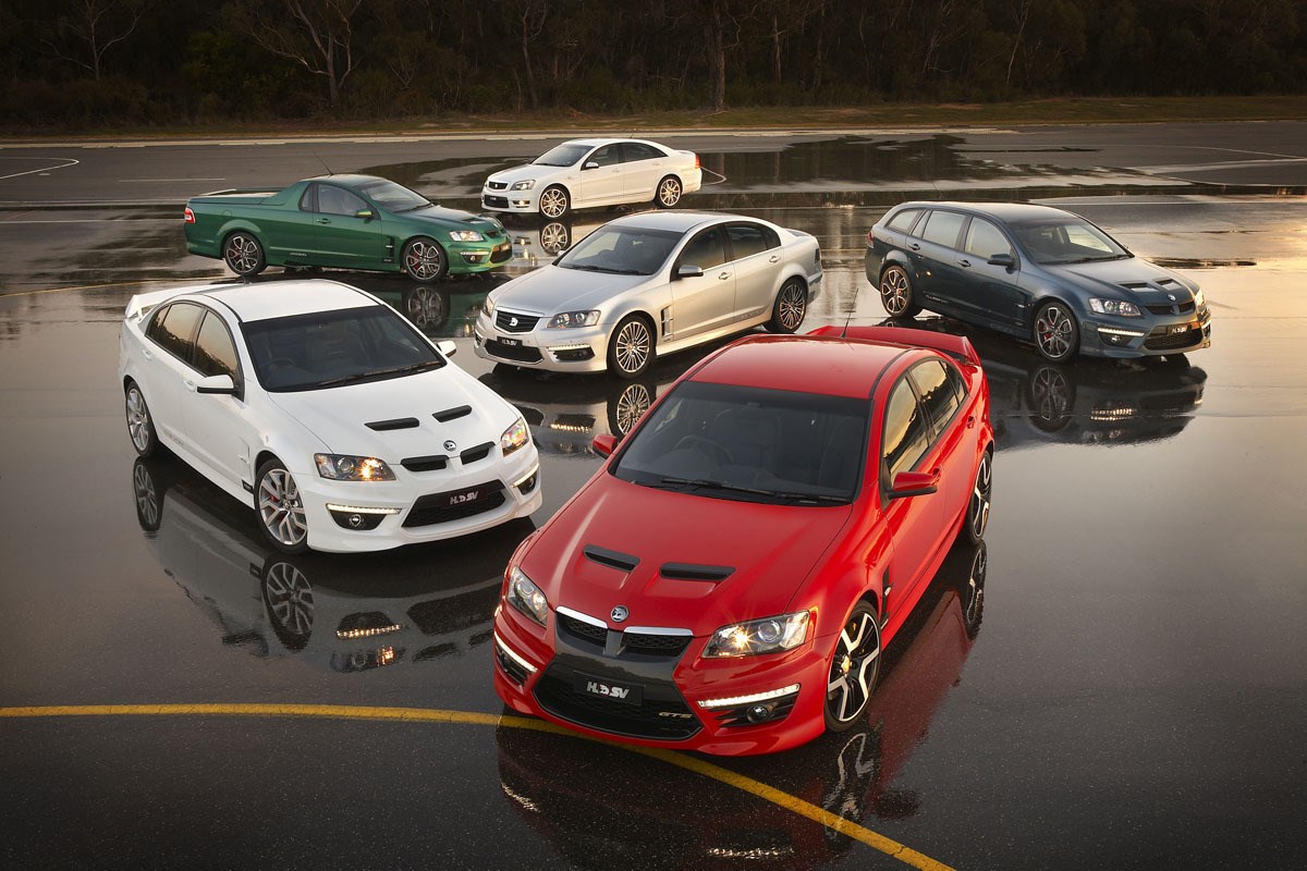 Holden HSV cars on wet asphalt HD Wallpaper