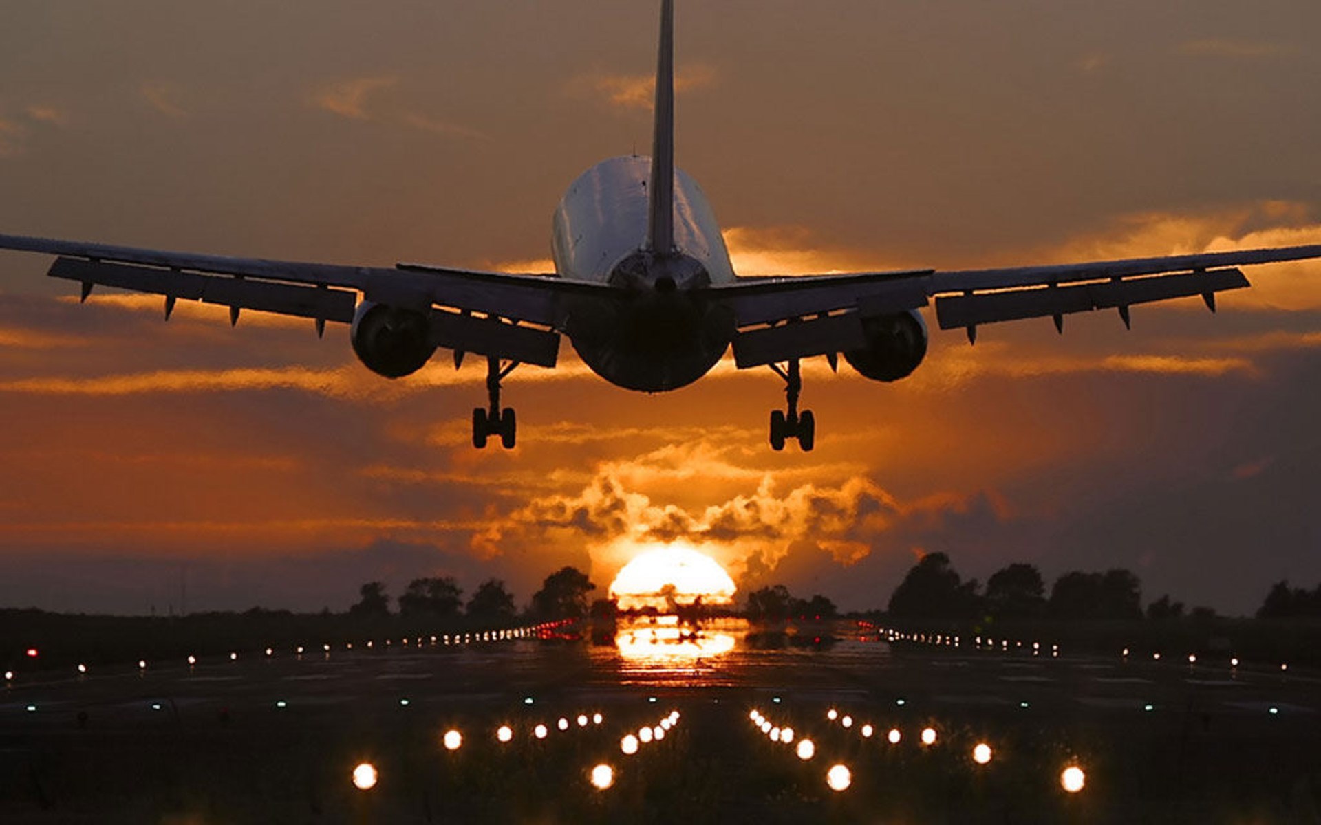 Boeing 767 landing at sunset HD Wallpaper