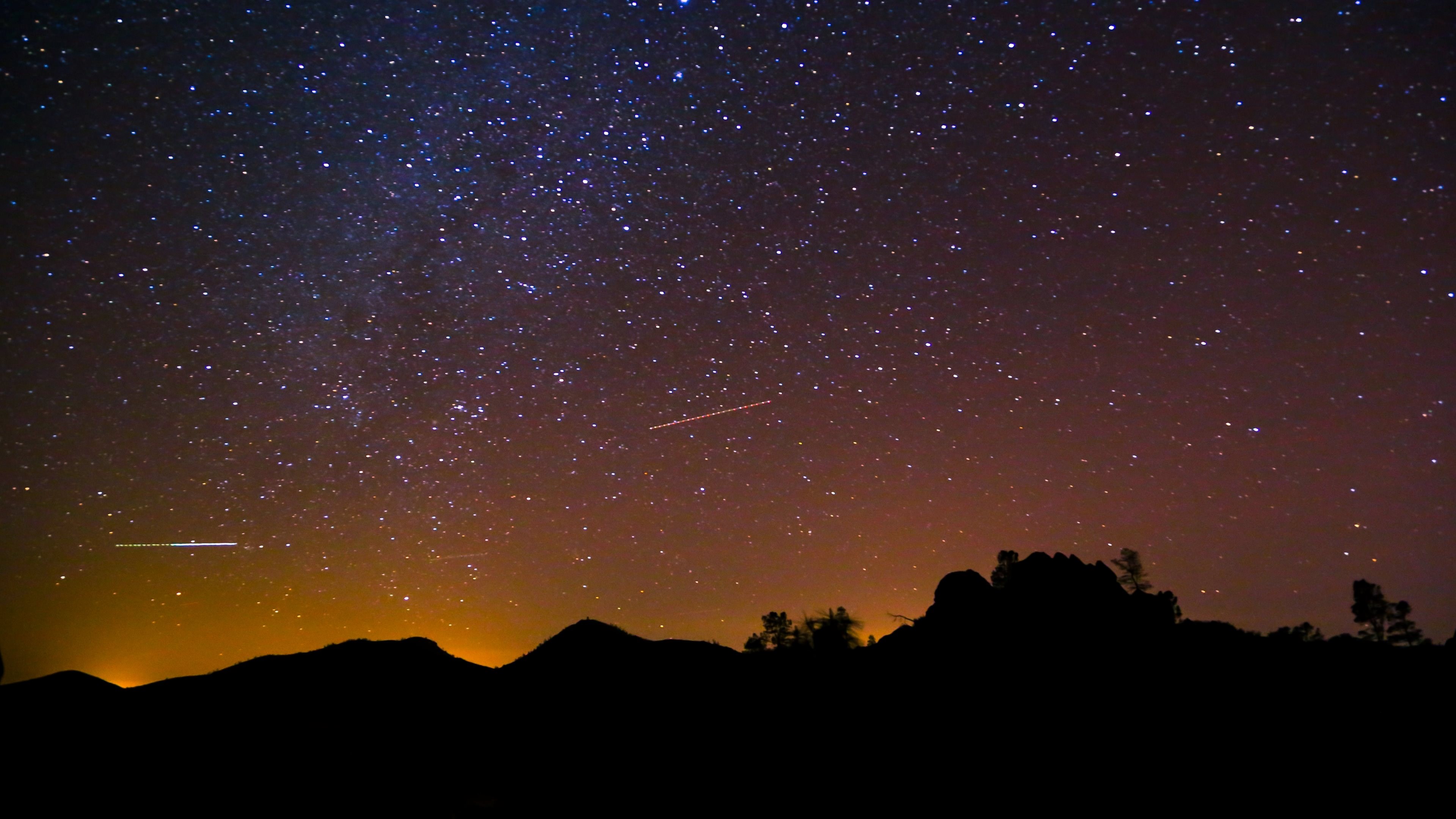 Night sky with stars and silhouette of mountains HD Wallpaper
