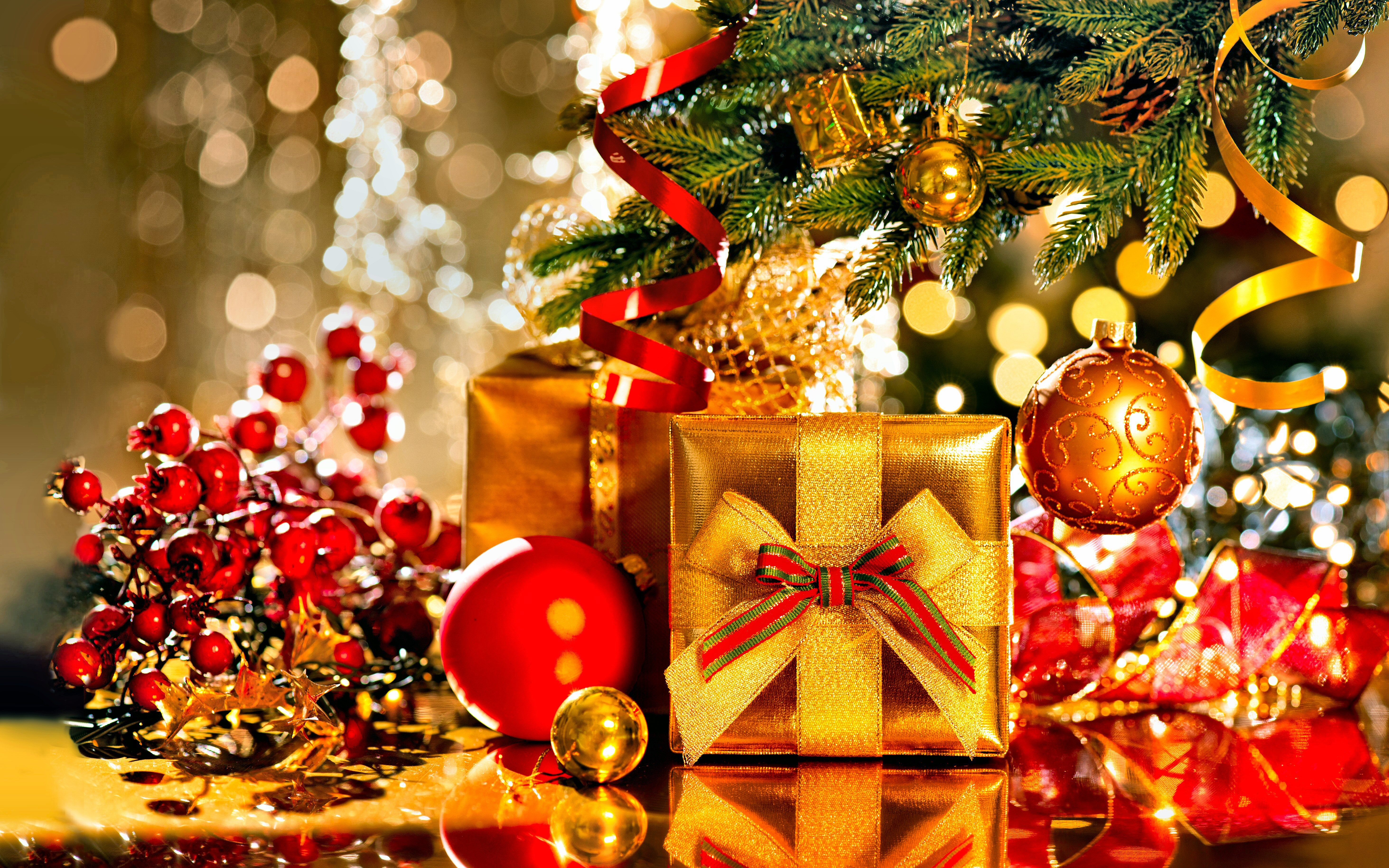 Christmas presents and ornaments under a tree HD Wallpaper