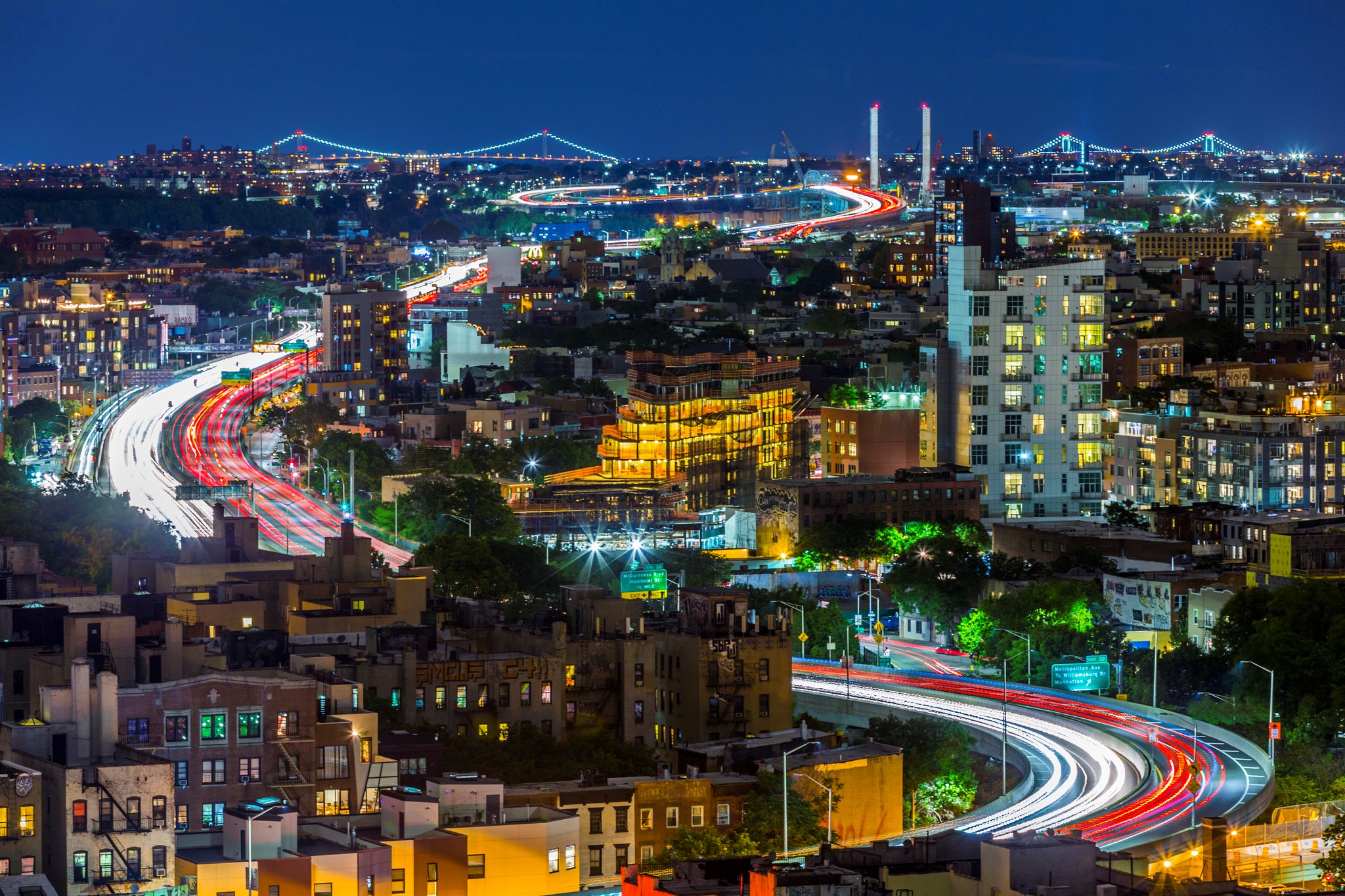 New York City Skyline at Night with Bridges and Traffic HD Wallpaper