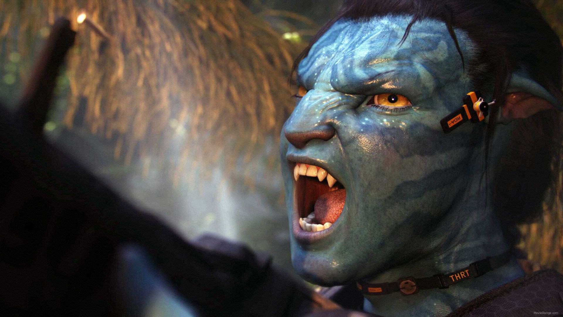Avatar character with a device on its ear HD Wallpaper