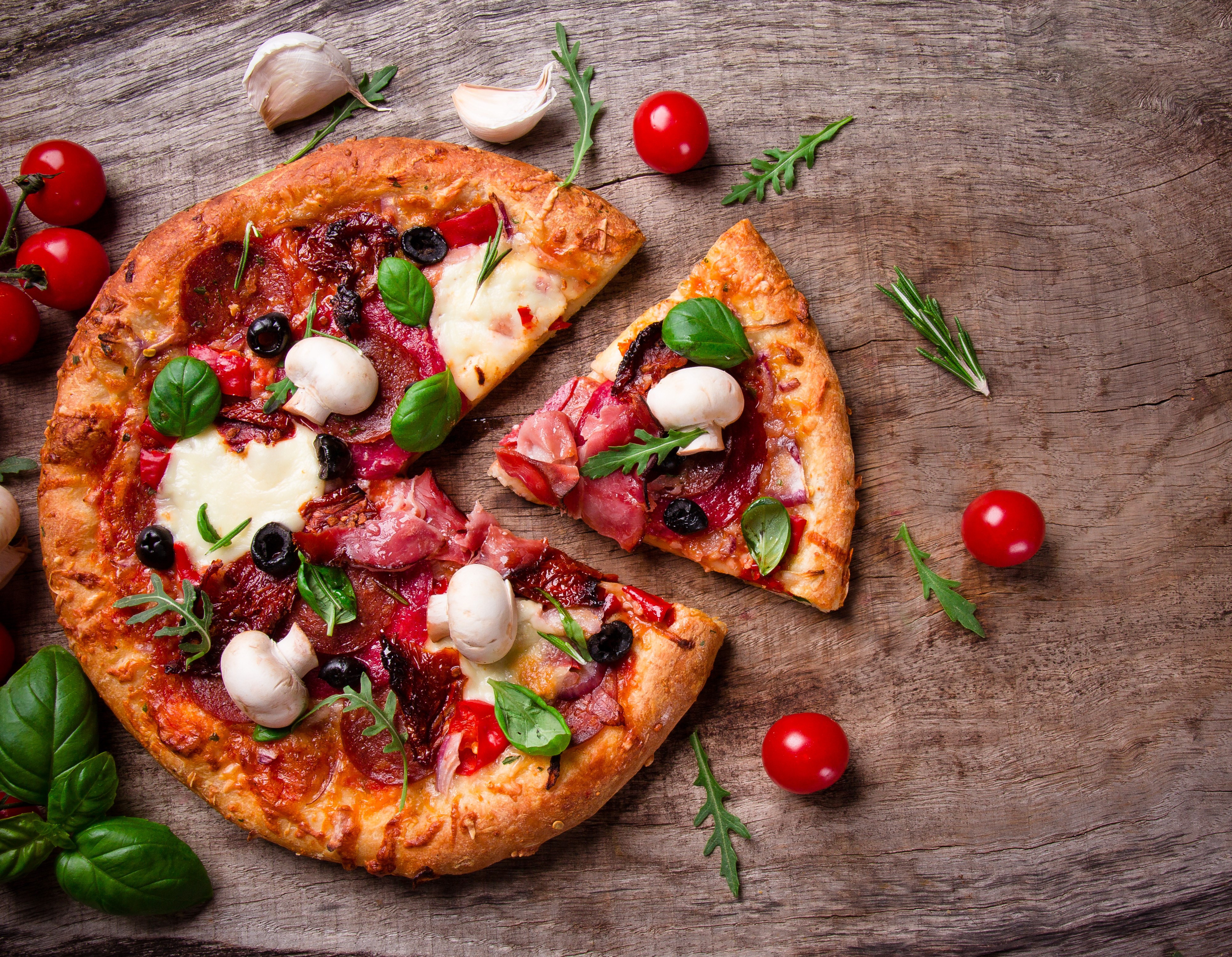 Delicious Pizza with Fresh Ingredients on Wooden Table HD Wallpaper