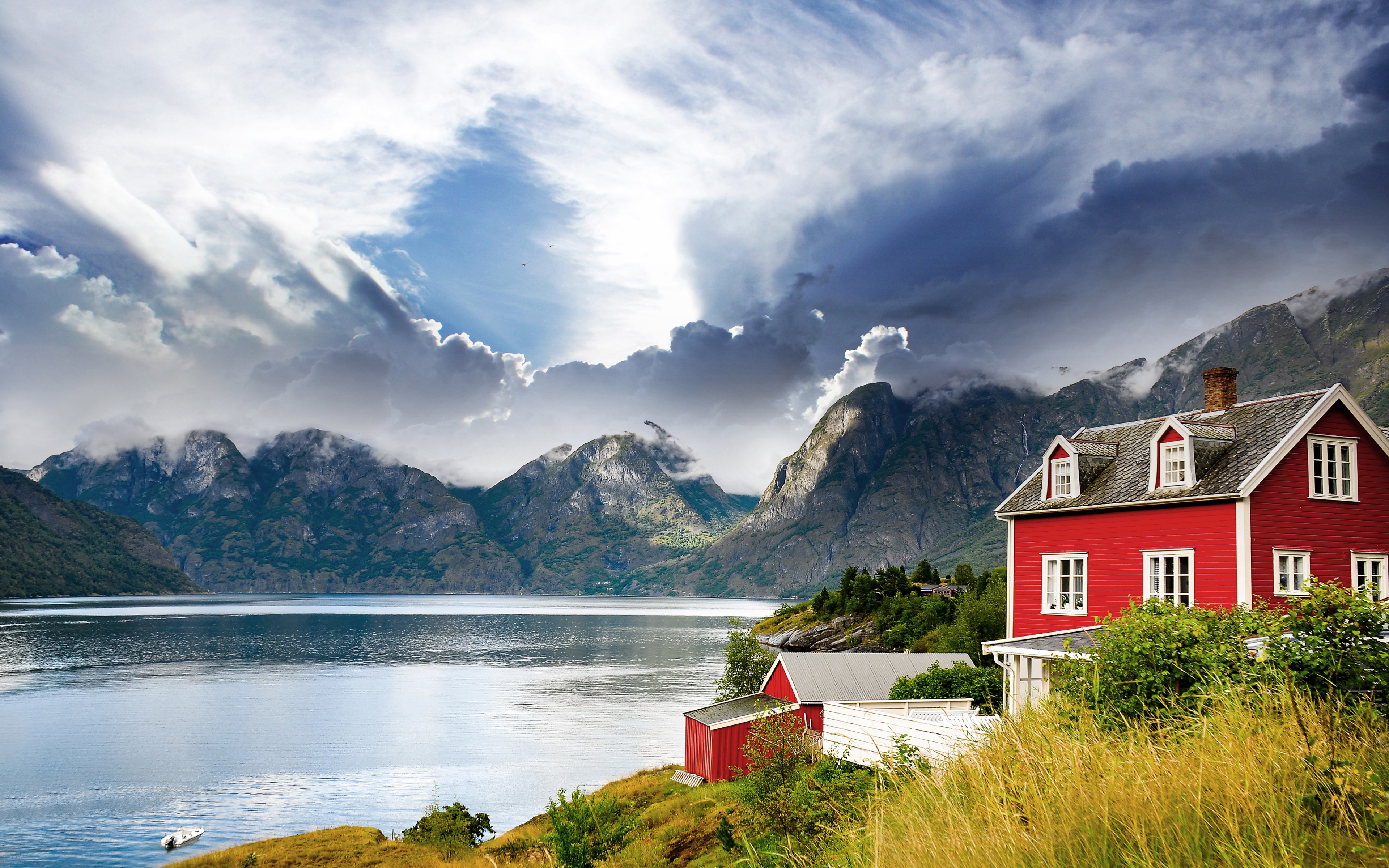 Red house by a fjord with mountains HD Wallpaper