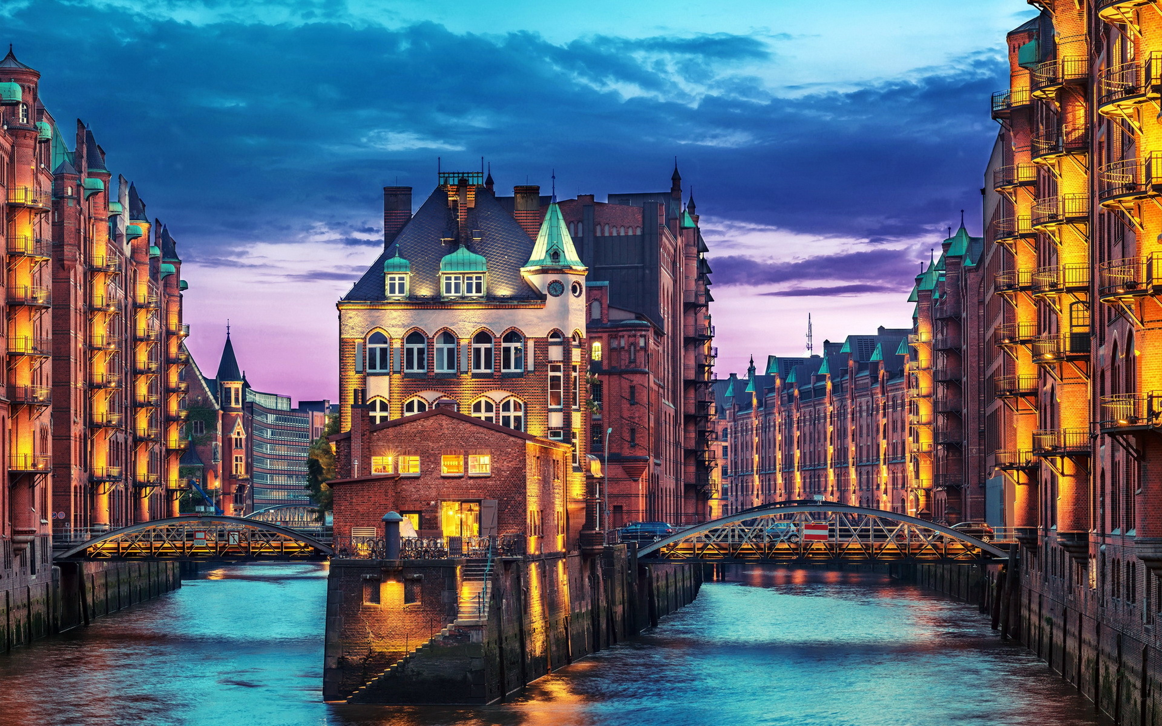 Speicherstadt Hamburg at dusk with canals and bridges HD Wallpaper