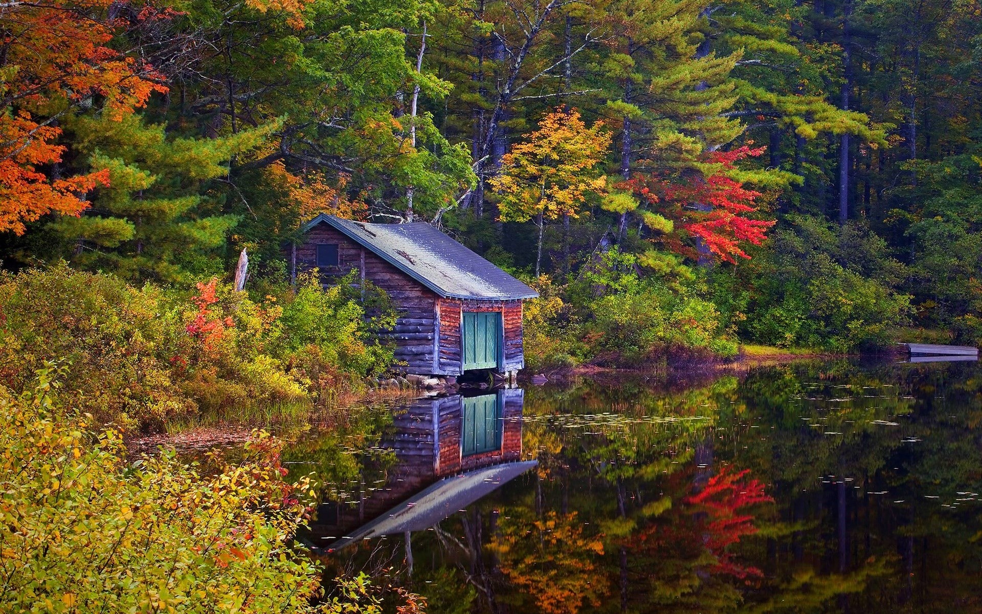 Wooden boathouse on a lake during autumn HD Wallpaper