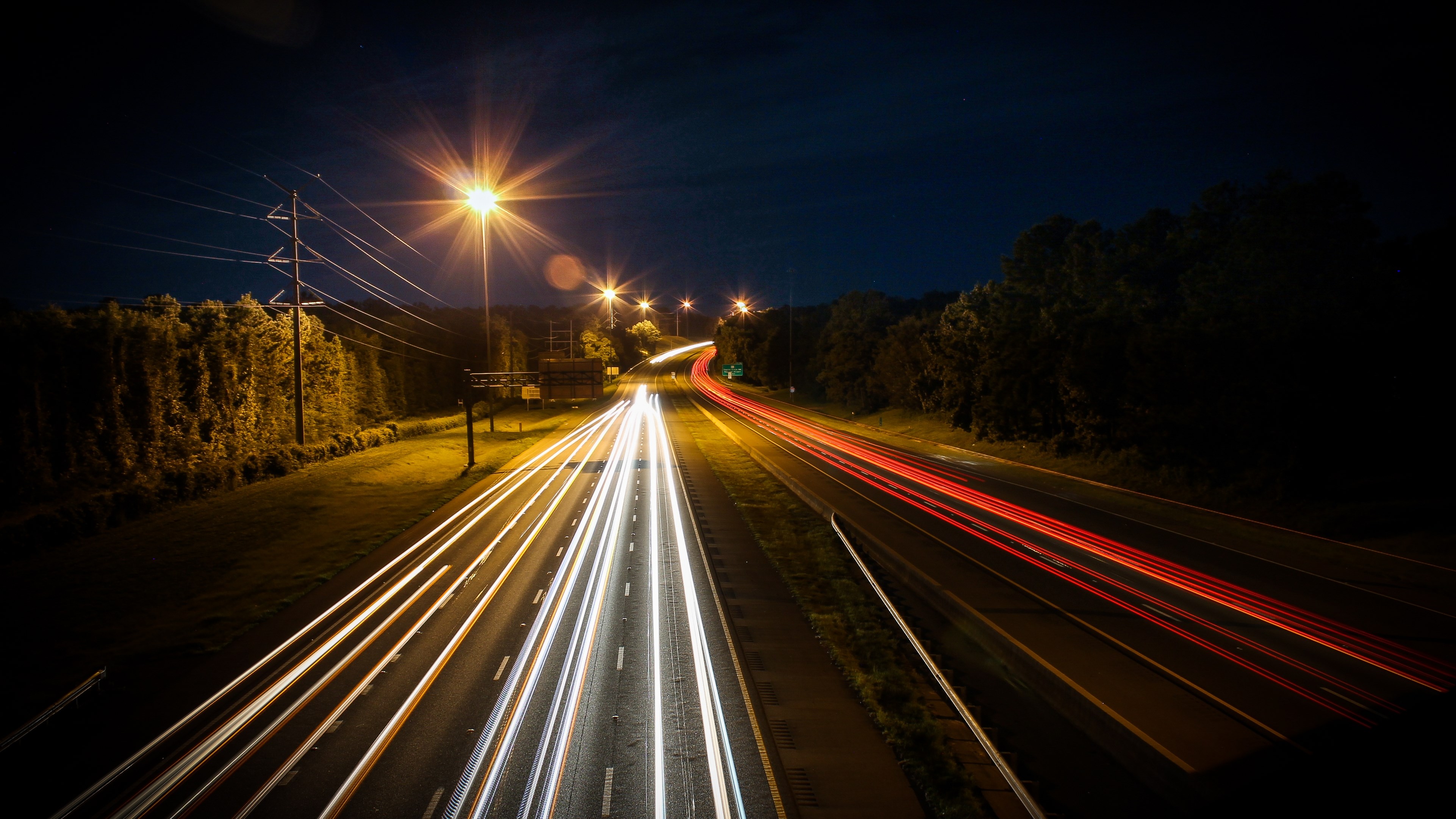 4K highway light trails at night HD Wallpaper