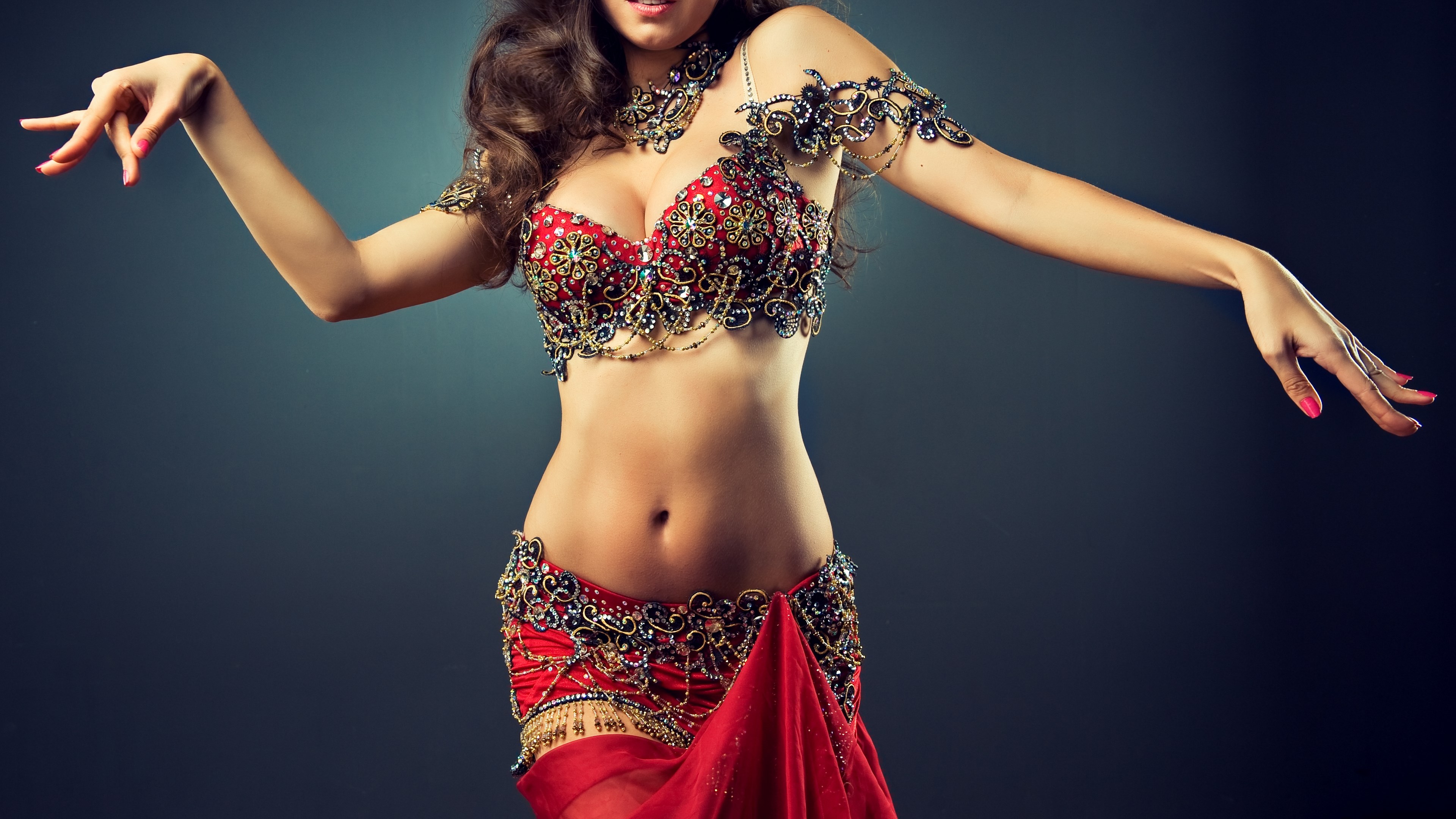 Woman in ornate belly dancing costume HD Wallpaper