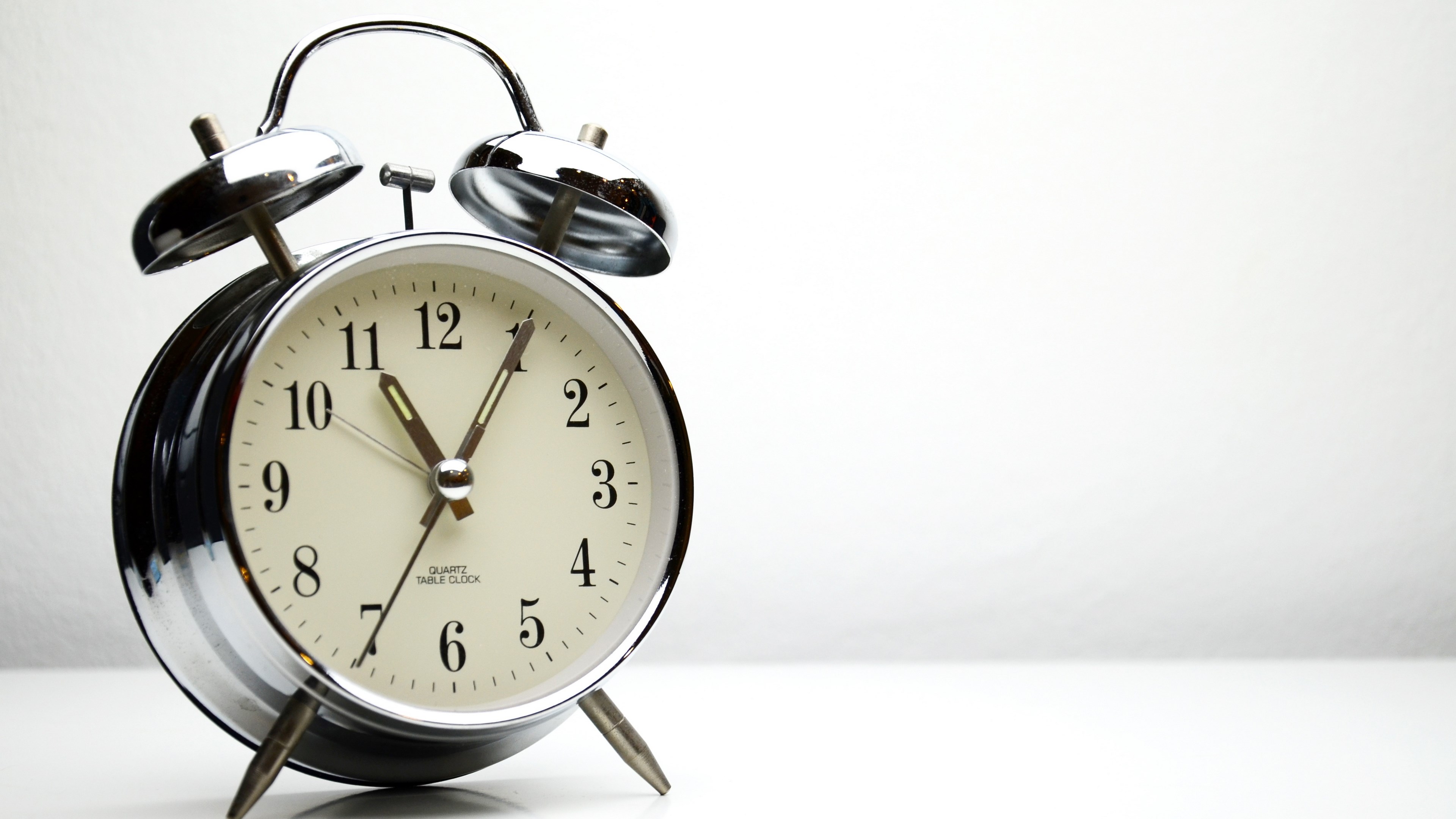 Alarm clock on a white background HD Wallpaper