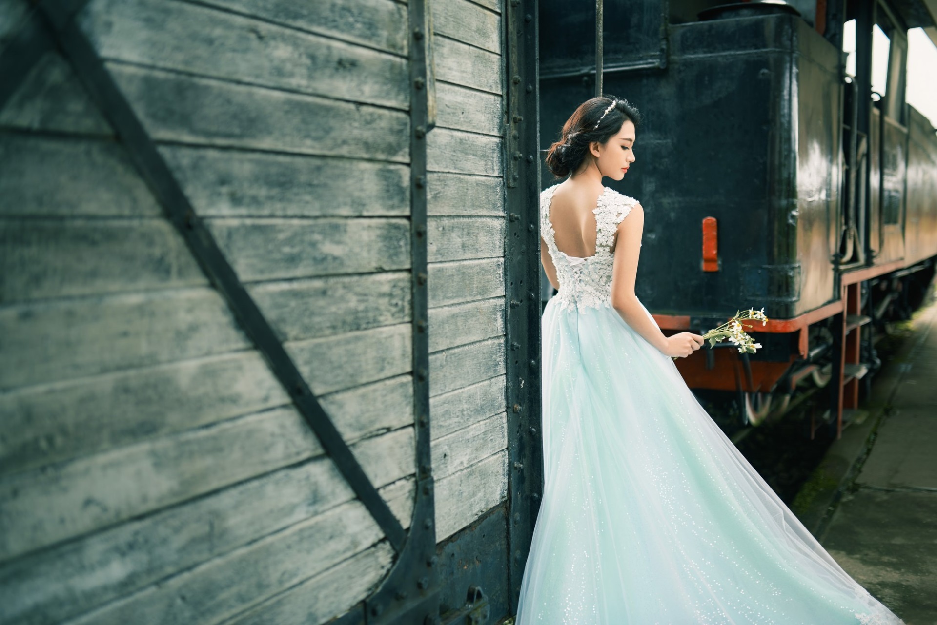 Bride in a light blue dress by a train HD Wallpaper