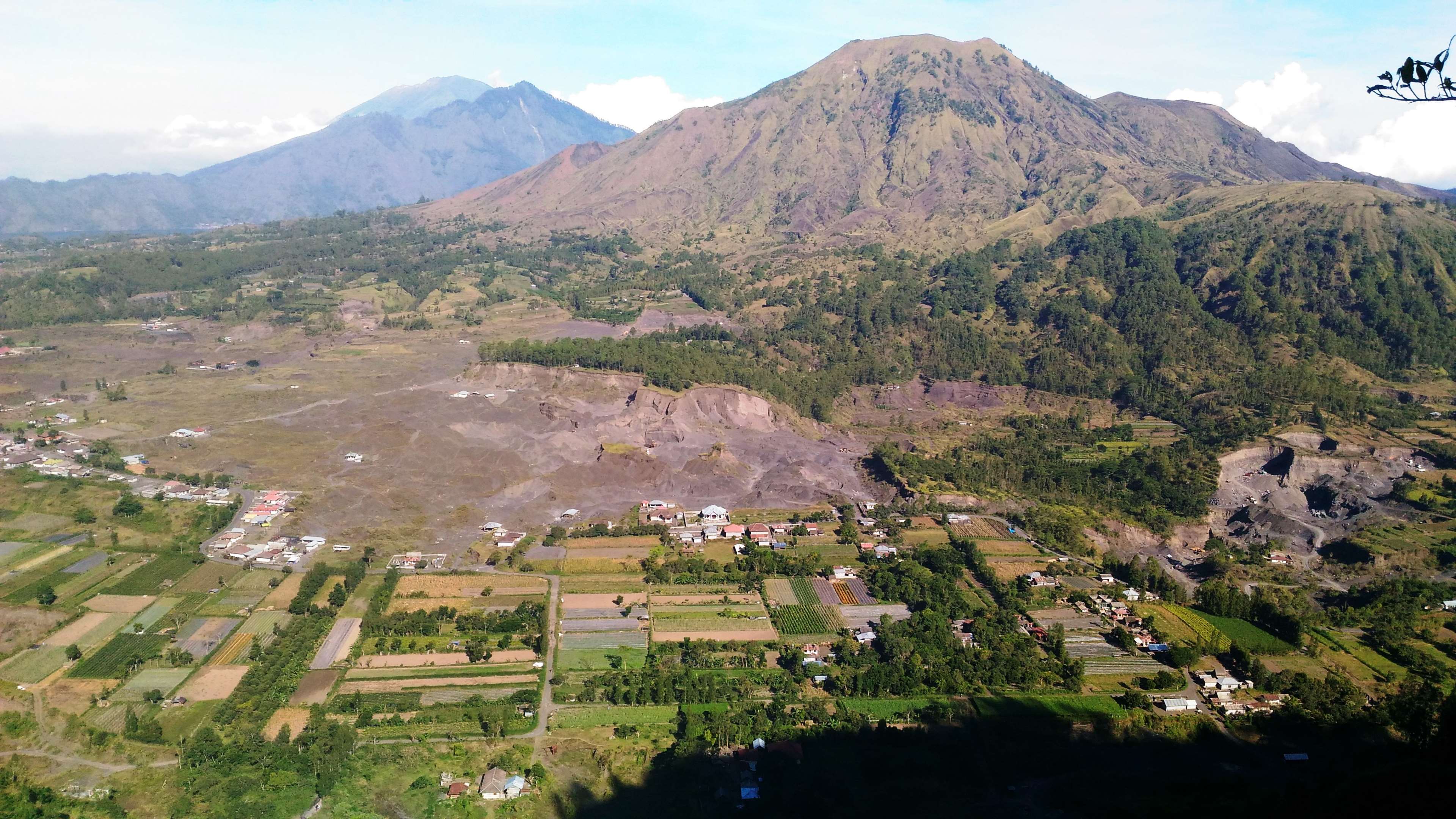 Aerial view of a village and mountains HD Wallpaper