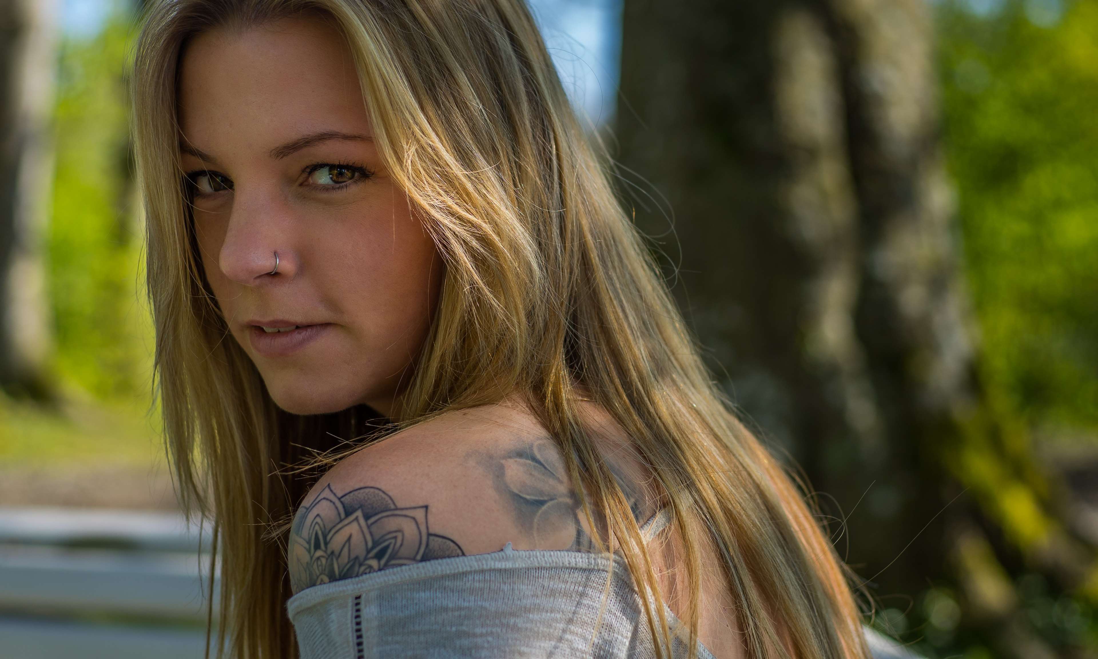 Young woman with blonde hair and tattoo HD Wallpaper