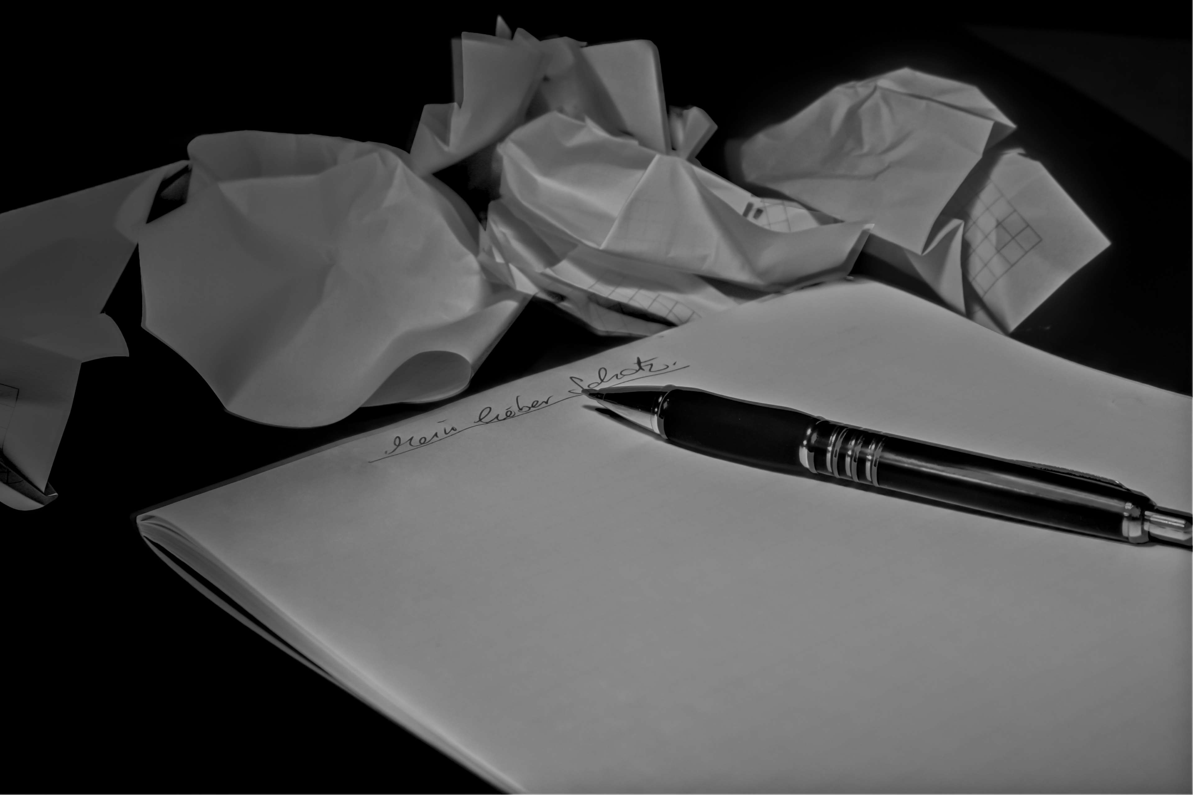 Crumpled papers and pen on notepad 4K HD Wallpaper