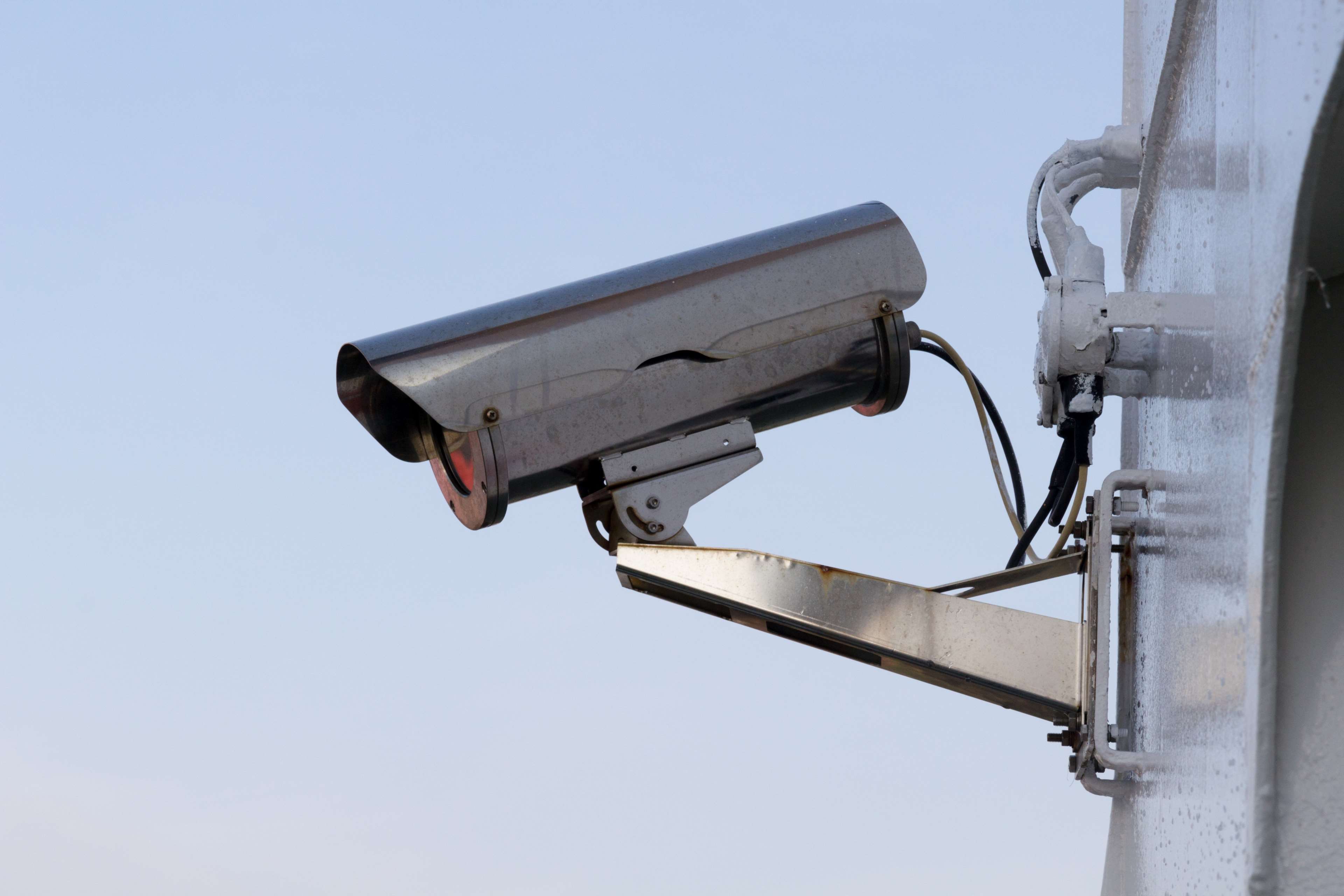 CCTV security camera mounted on a pole HD Wallpaper