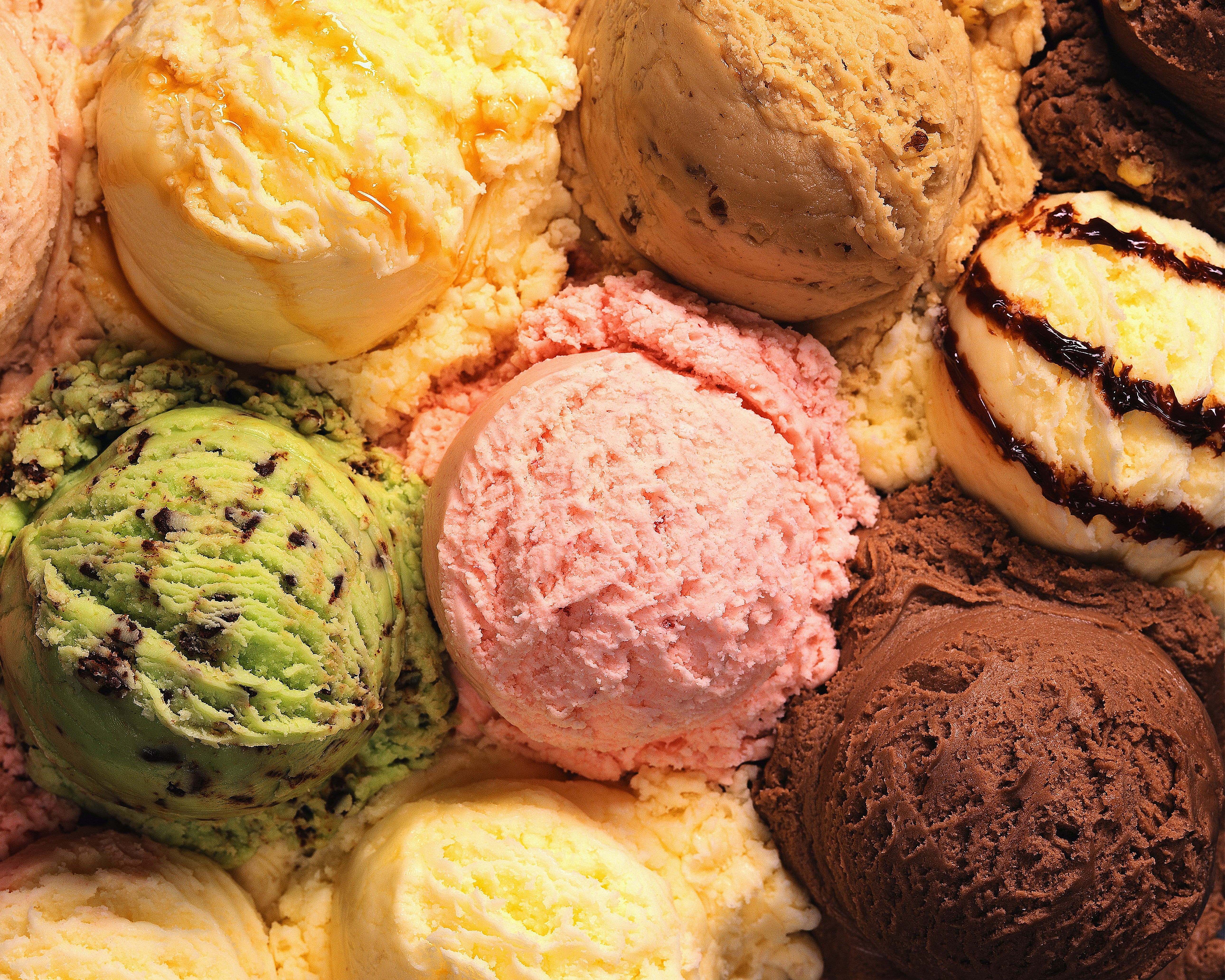 Colorful Scoops of Various Ice Cream Flavors HD Wallpaper