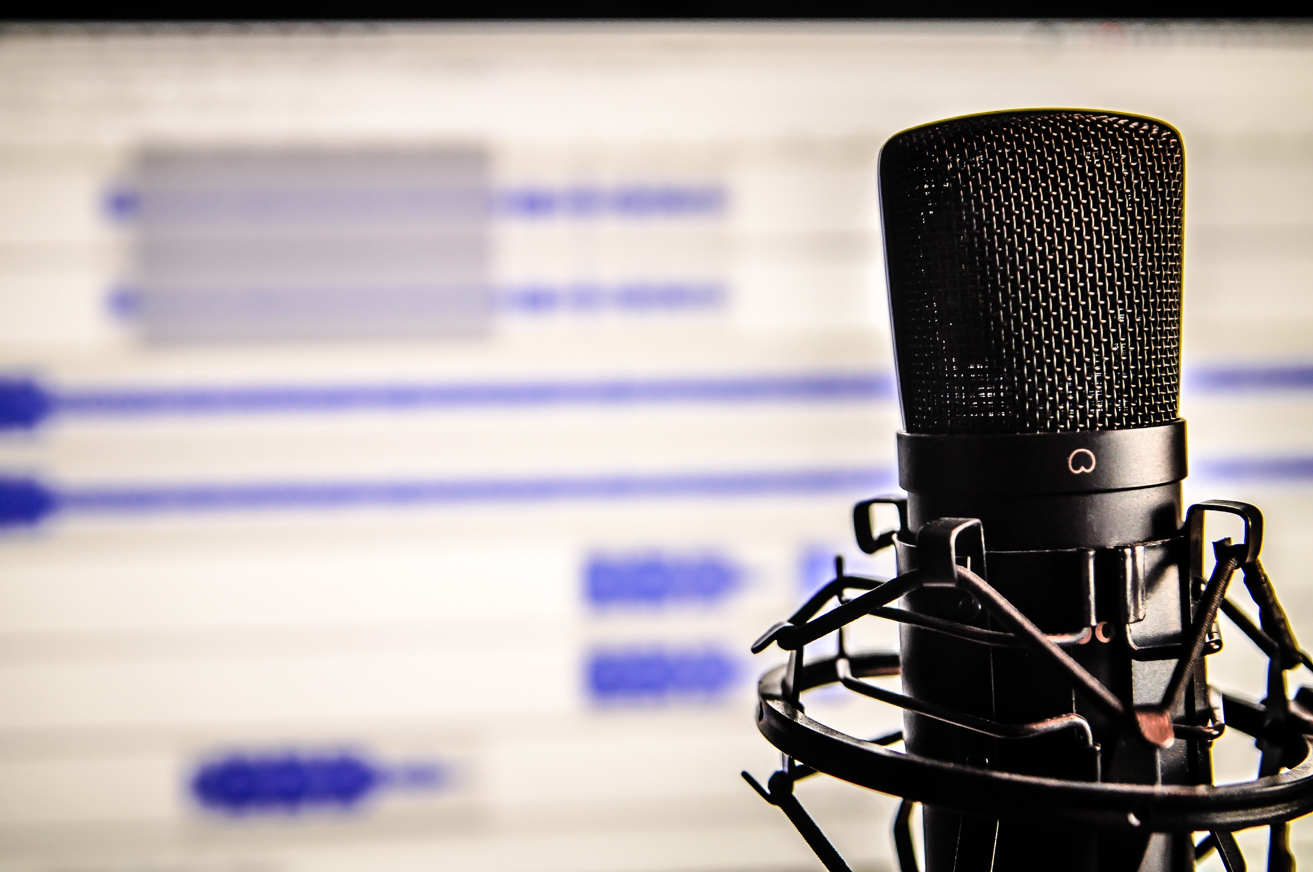 Microphone in recording studio with audio waveform HD Wallpaper