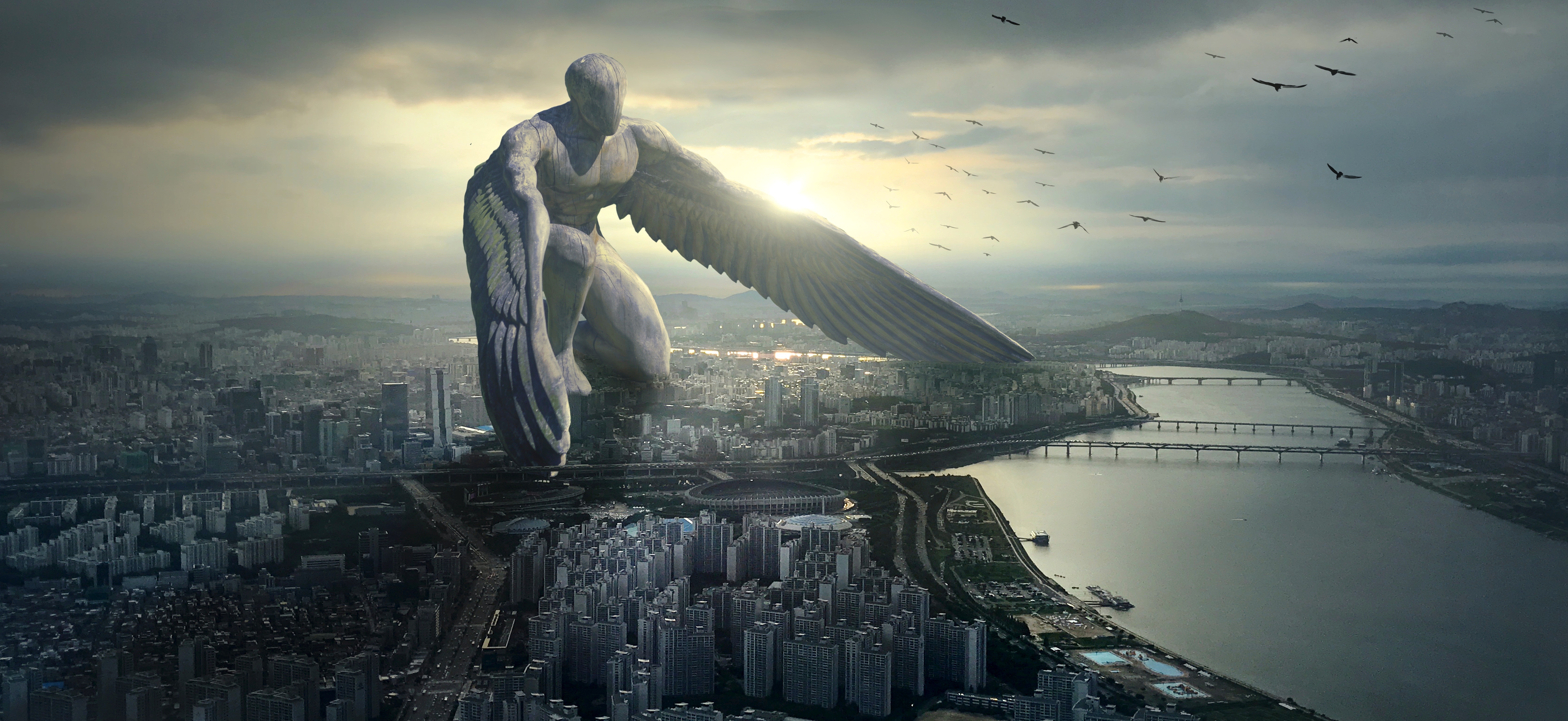 Giant Winged Angel Over City at Sunset 4K HD Wallpaper