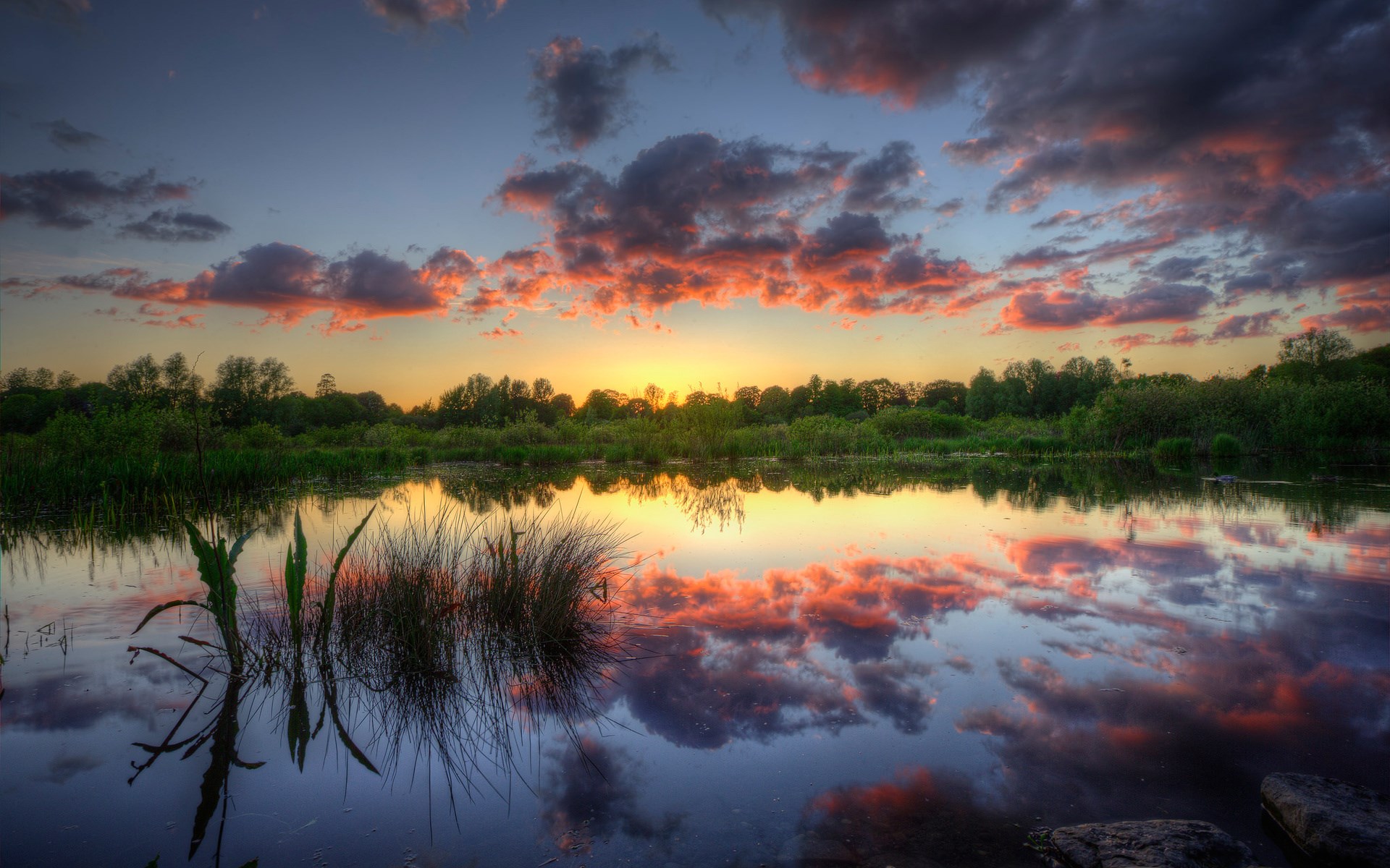 Sunset over a calm lake with colorful clouds HD Wallpaper