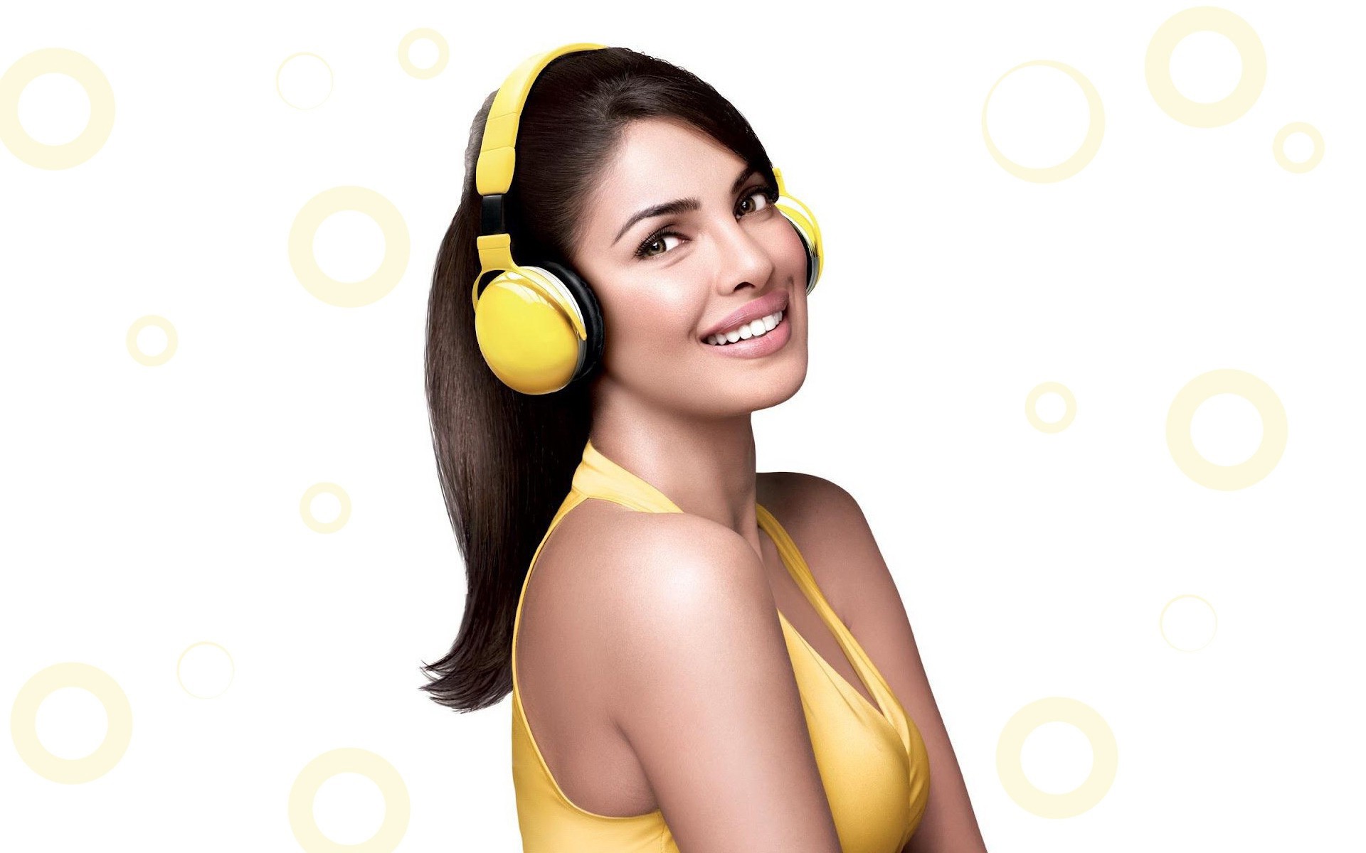 Priyanka Chopra wearing yellow headphones and top HD Wallpaper