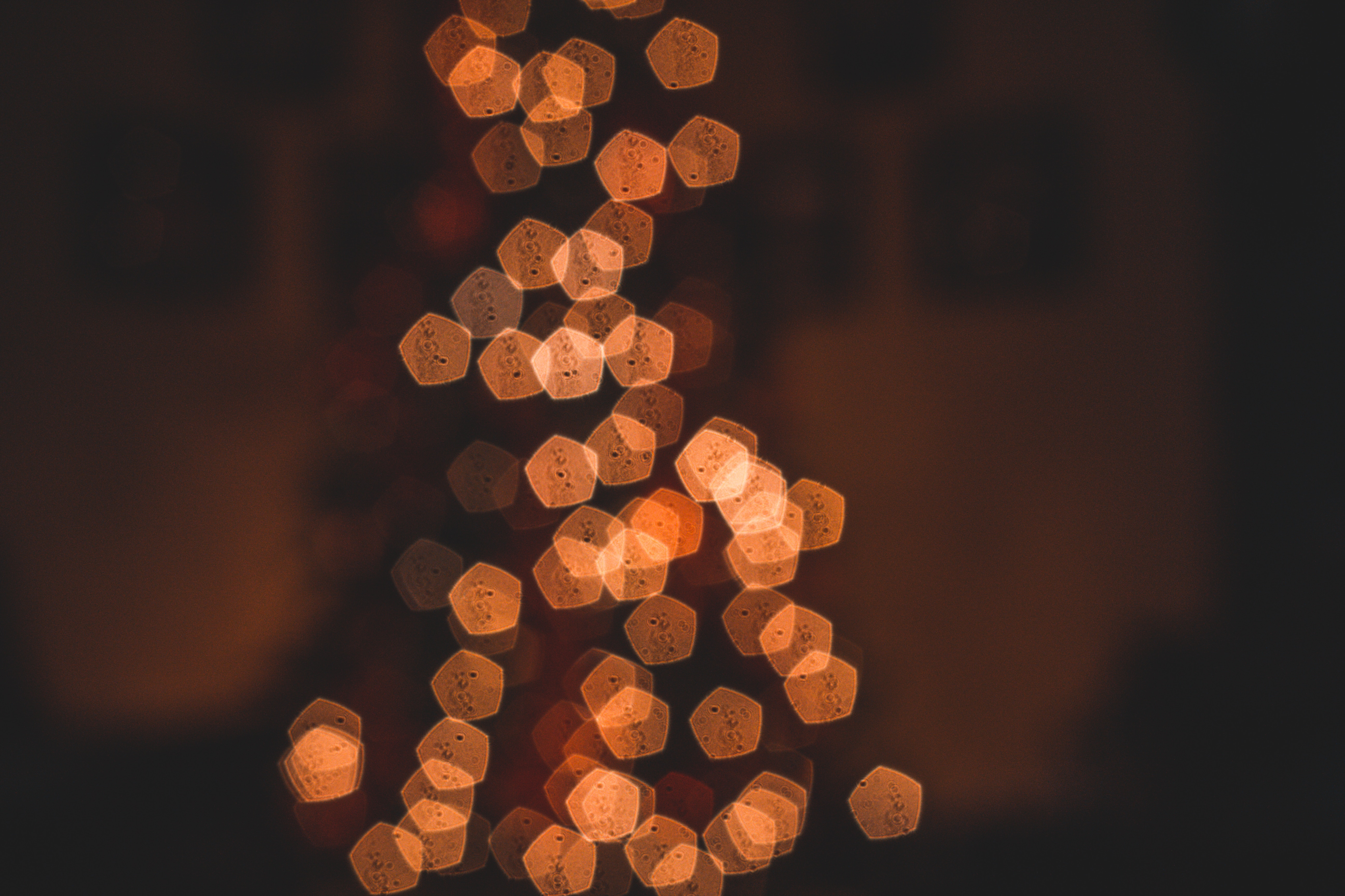 Bokeh lights in pentagon shapes on a dark background HD Wallpaper