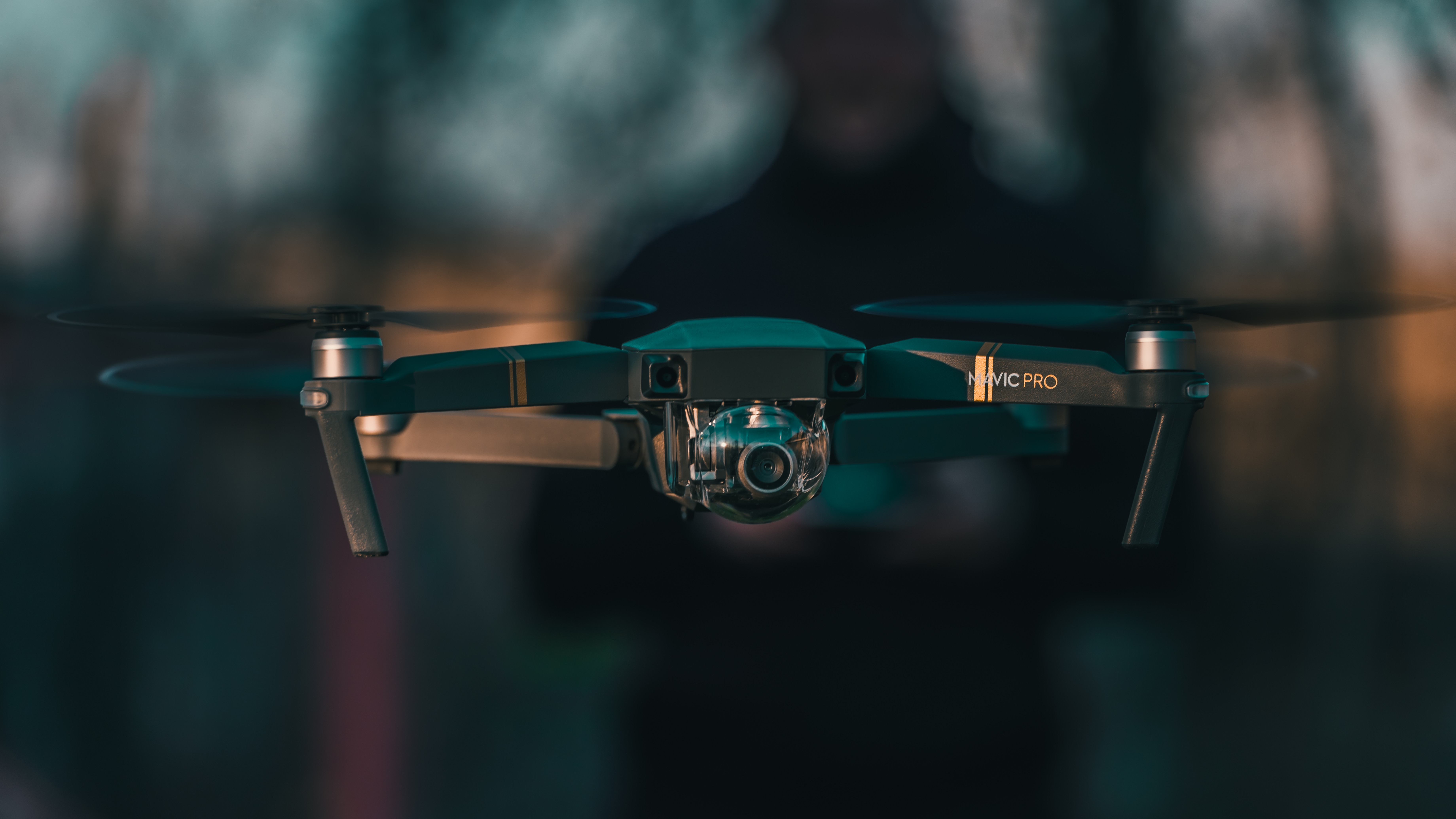 DJI Mavic Pro drone hovering with camera HD Wallpaper