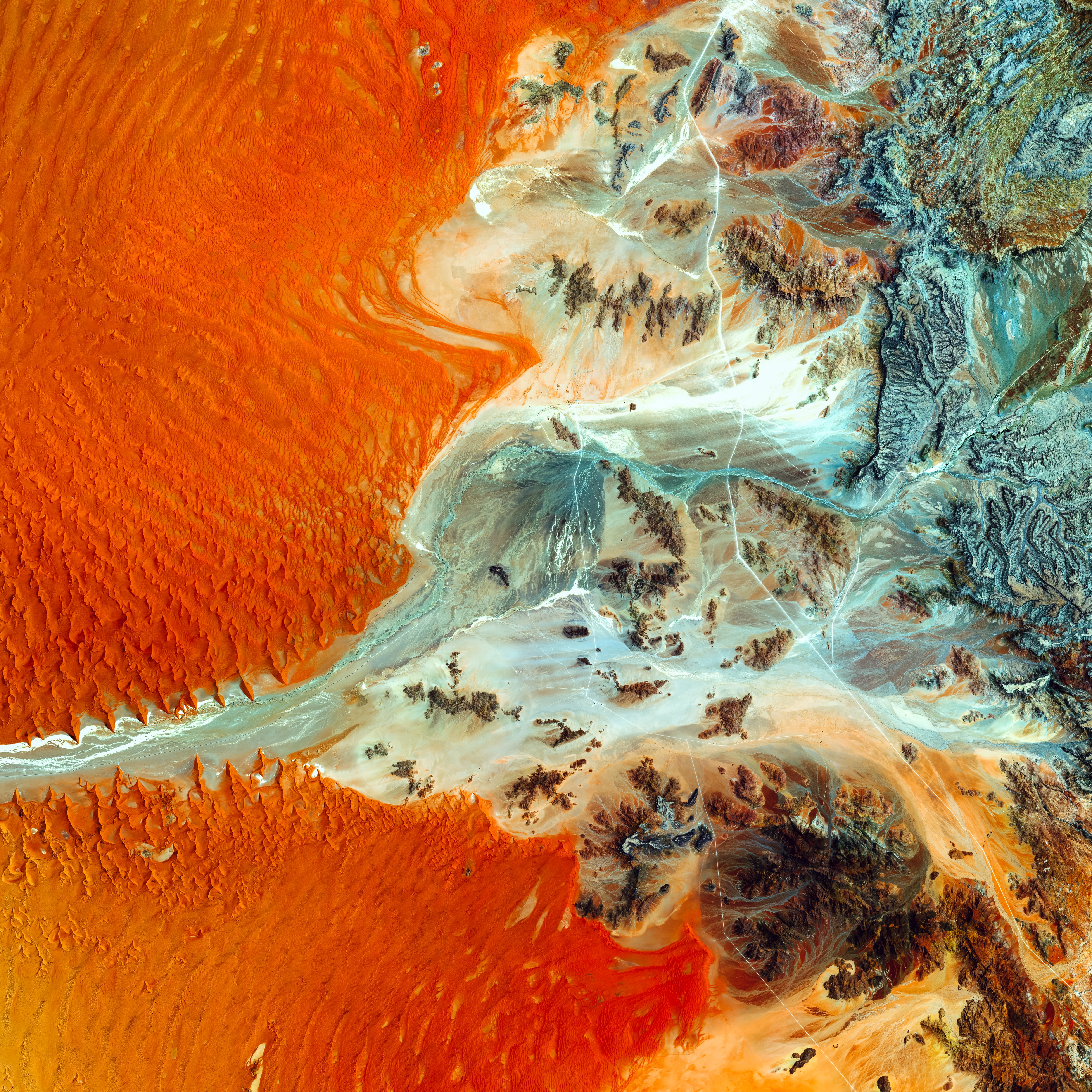 Aerial view of desert landscape in Namibia with sand dunes and mountains HD Wallpaper
