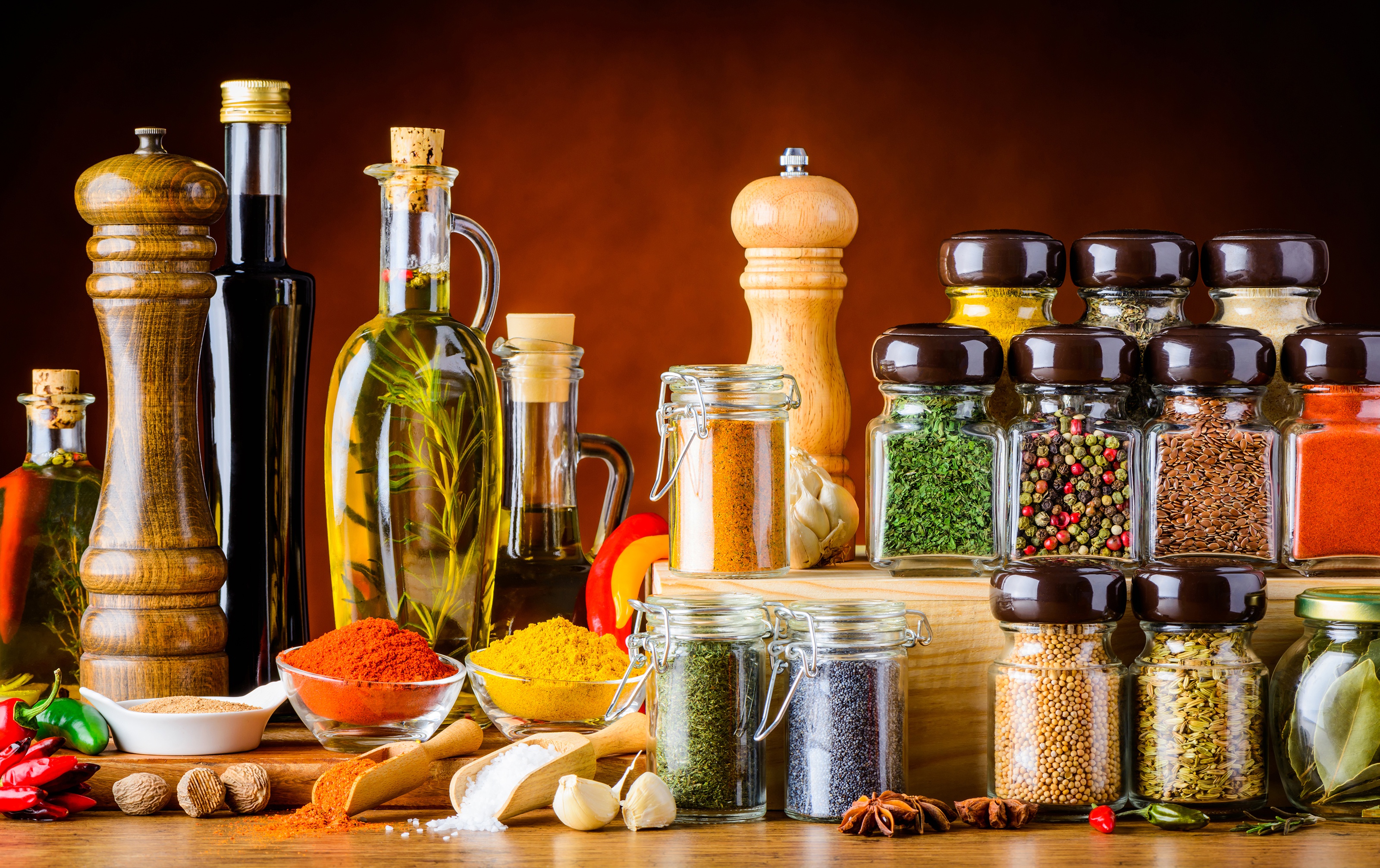 Still life of spices and oils on a wooden table HD Wallpaper