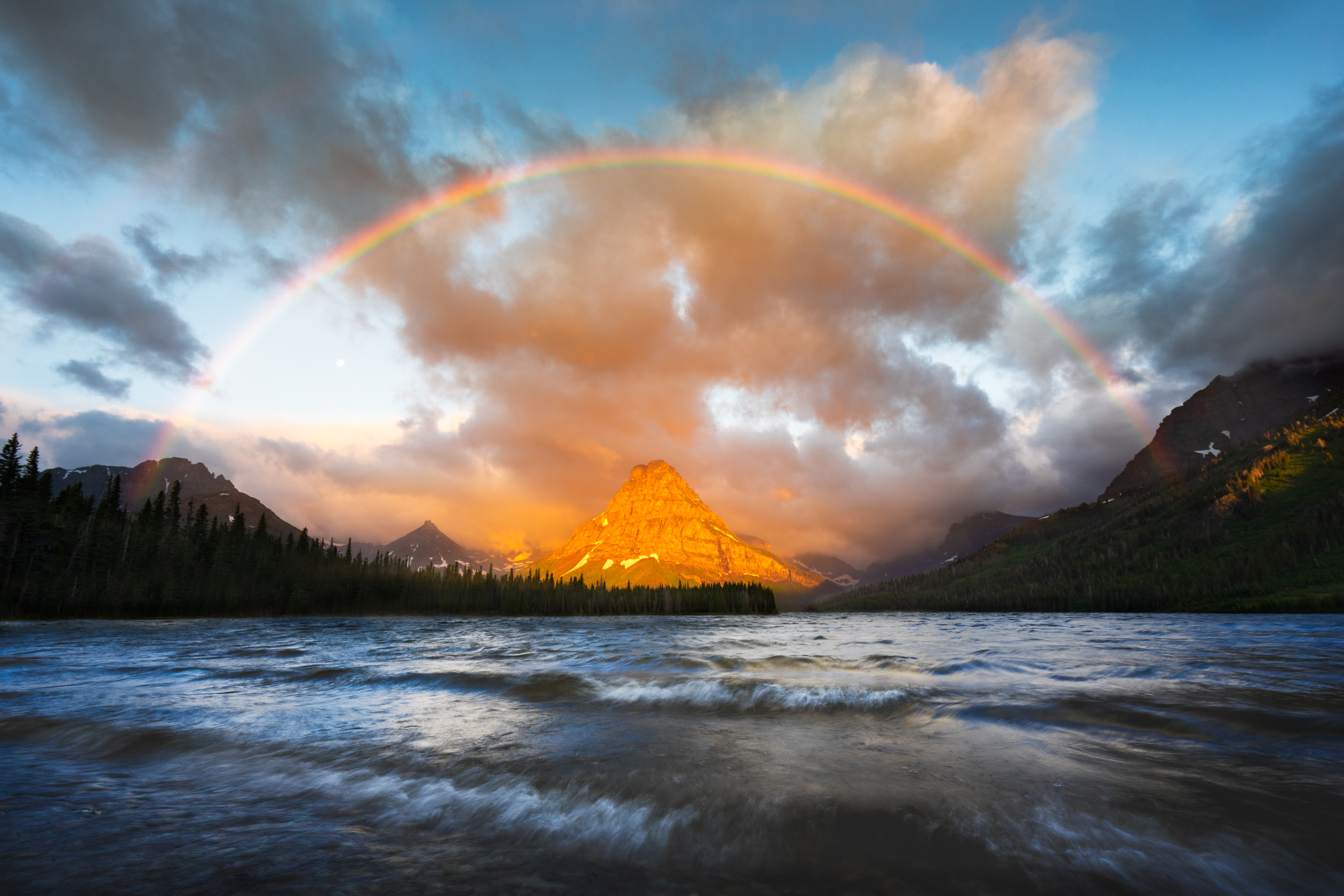 Rainbow over a mountain lake at sunset HD Wallpaper